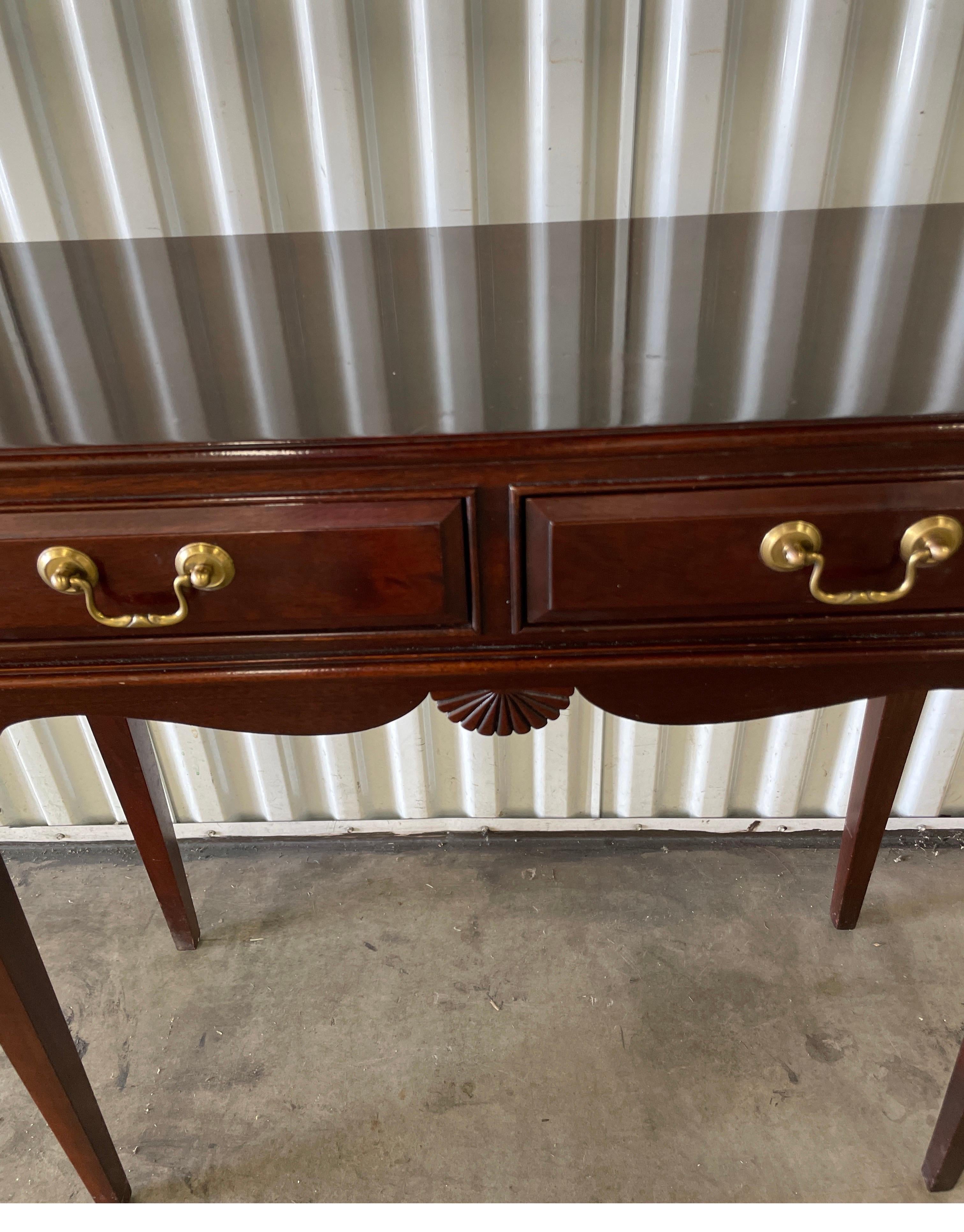 Vintage small mahogany console with one drawer.