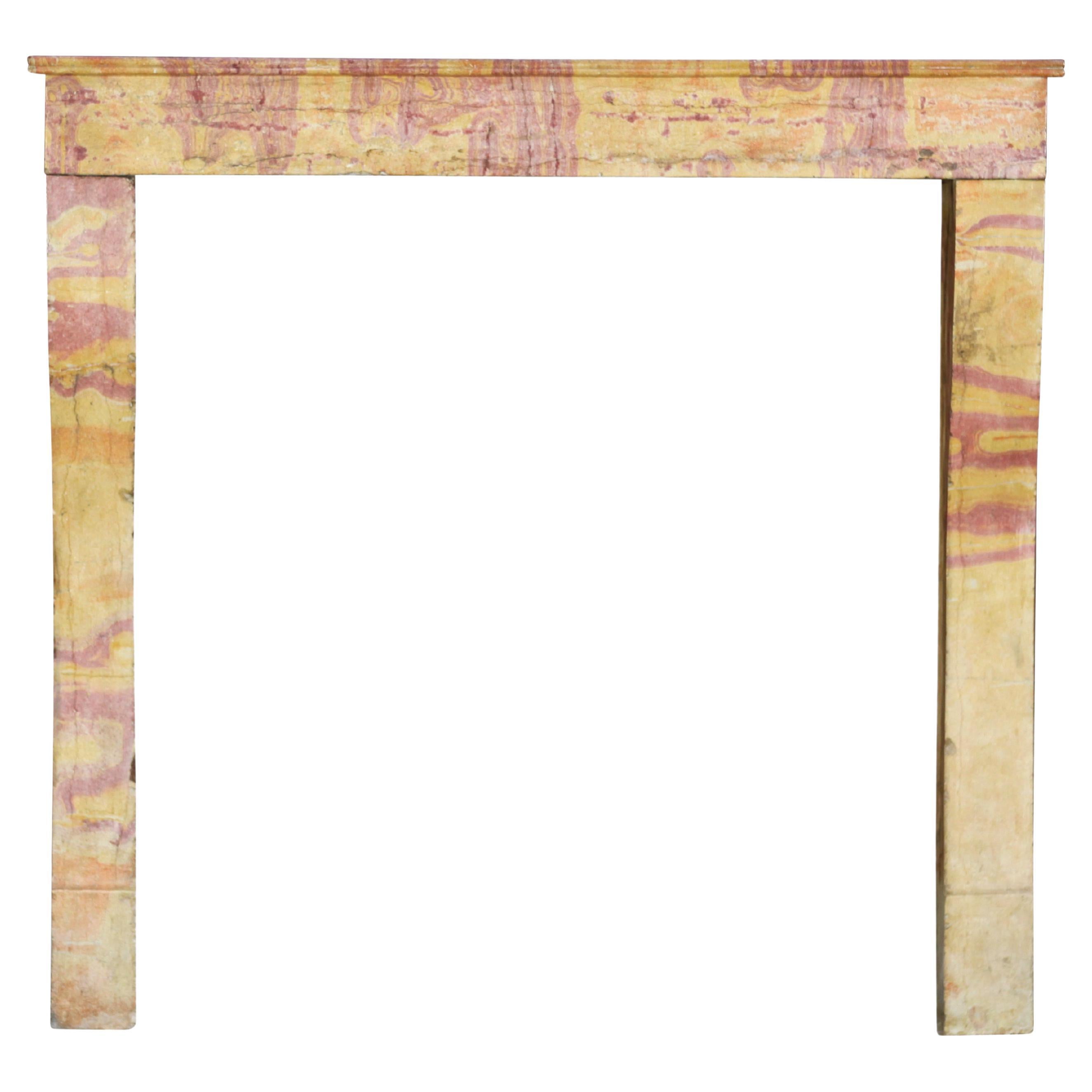 Small European Fireplace Surround in Multicolour French Burgundy Stone  For Sale
