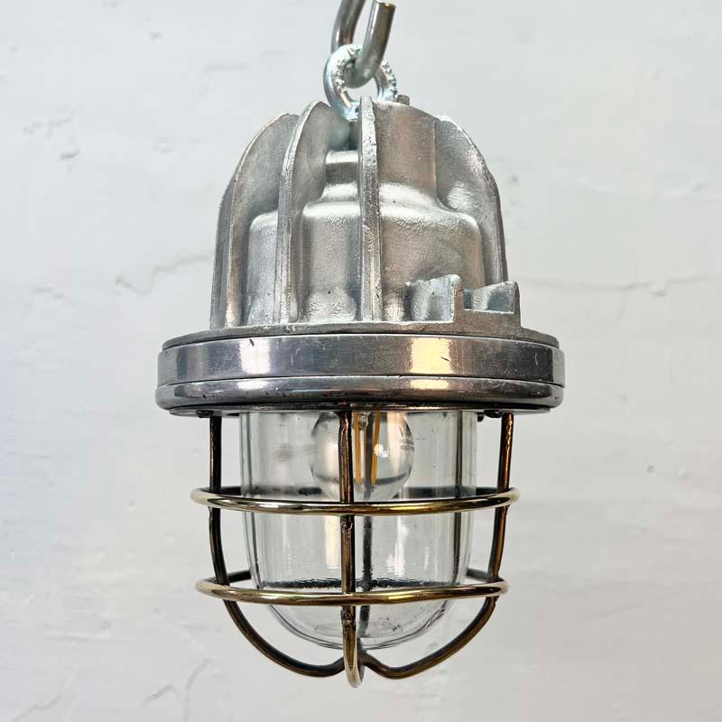 This small cage pendant light is an original industrial explosion proof lamp which we have reclaimed and rewired. Being a smaller ceiling light, makes them highly versatile for adding authentic industrial style into a variety of interiors. 

The