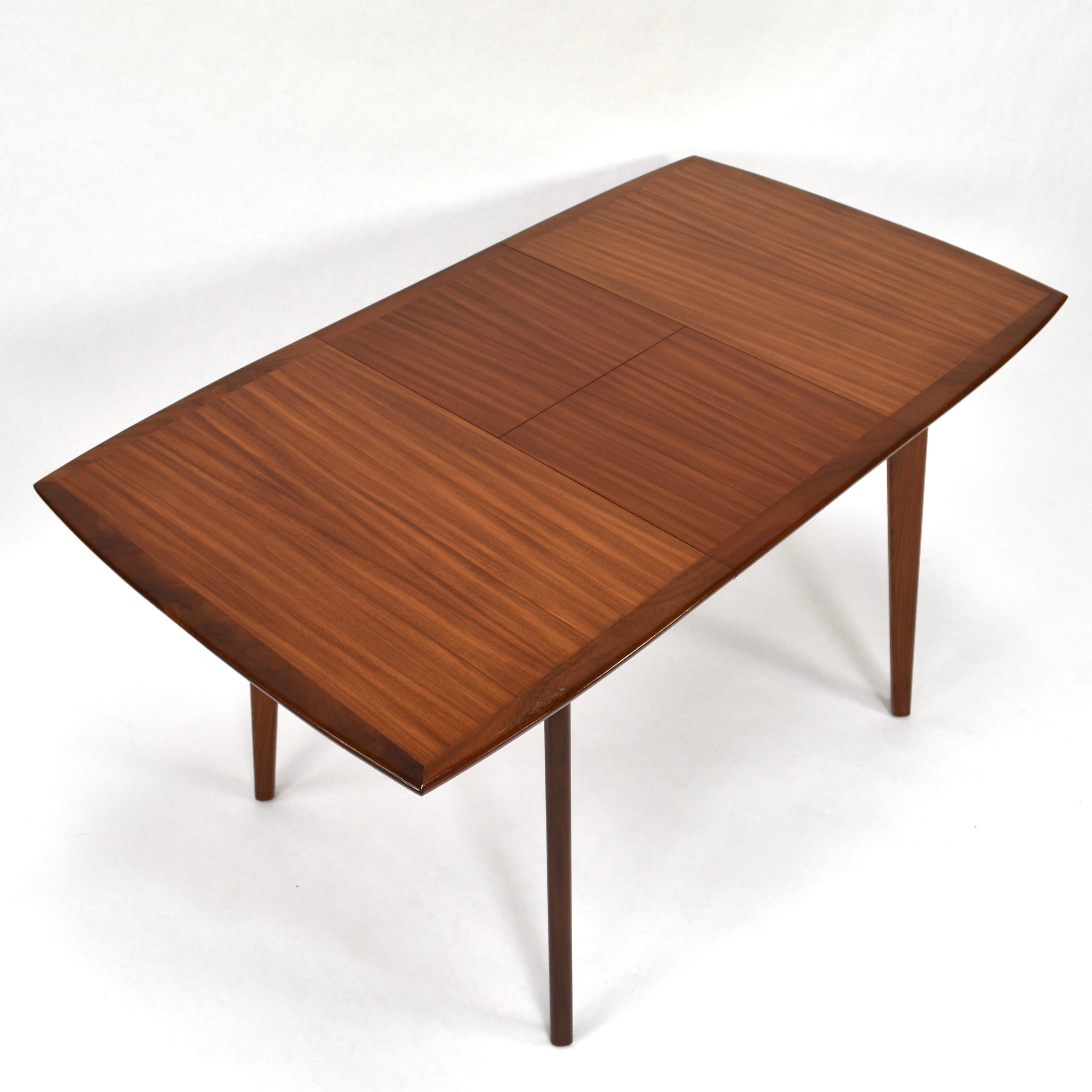 Teak fold-out dining table by Louis van Teeffelen for WeBe, Netherlands, 1960s
Teak veneer top with solid teak edges and legs.
In very good condition.
Legs can be taken of.
Minor wear on one edge (see picture)
Size in cm:
W. 100 (extracted