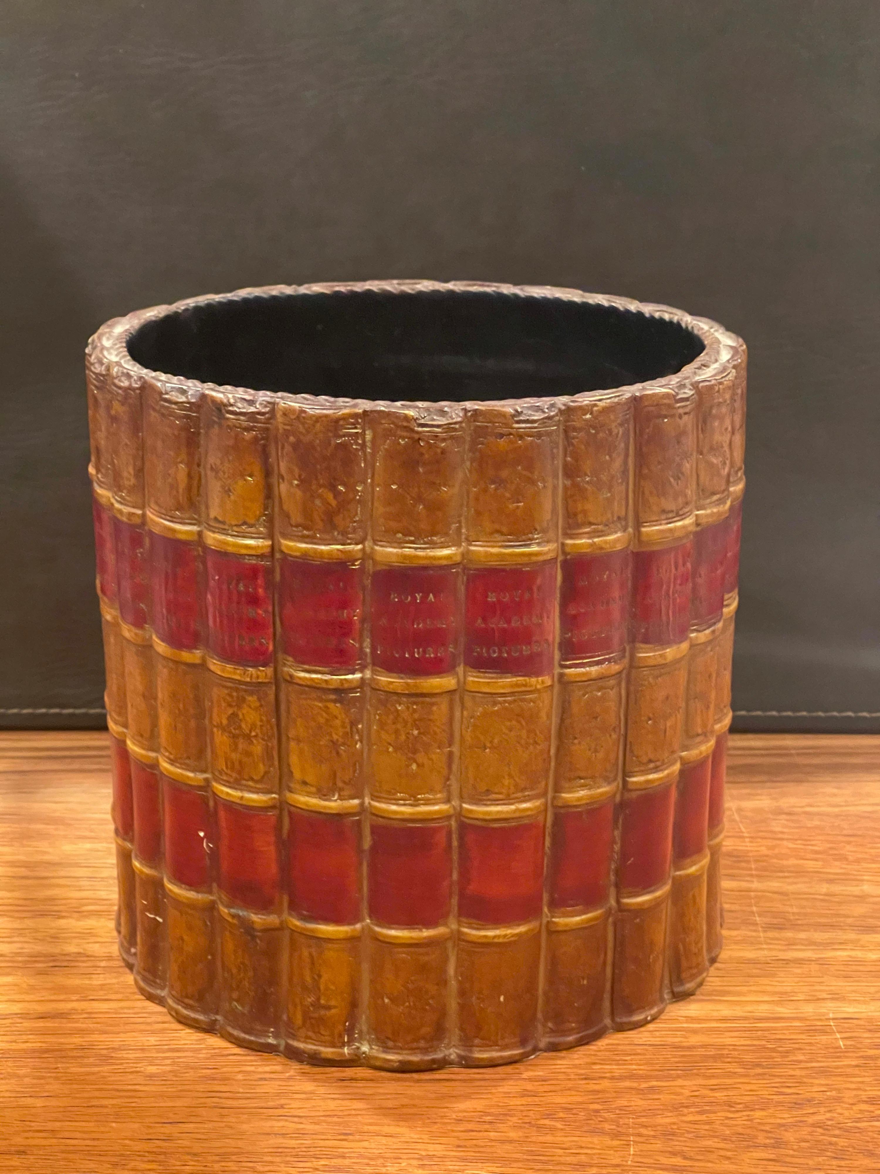 A stylish Edwardian inspired waste basket with faux book spines entitled 