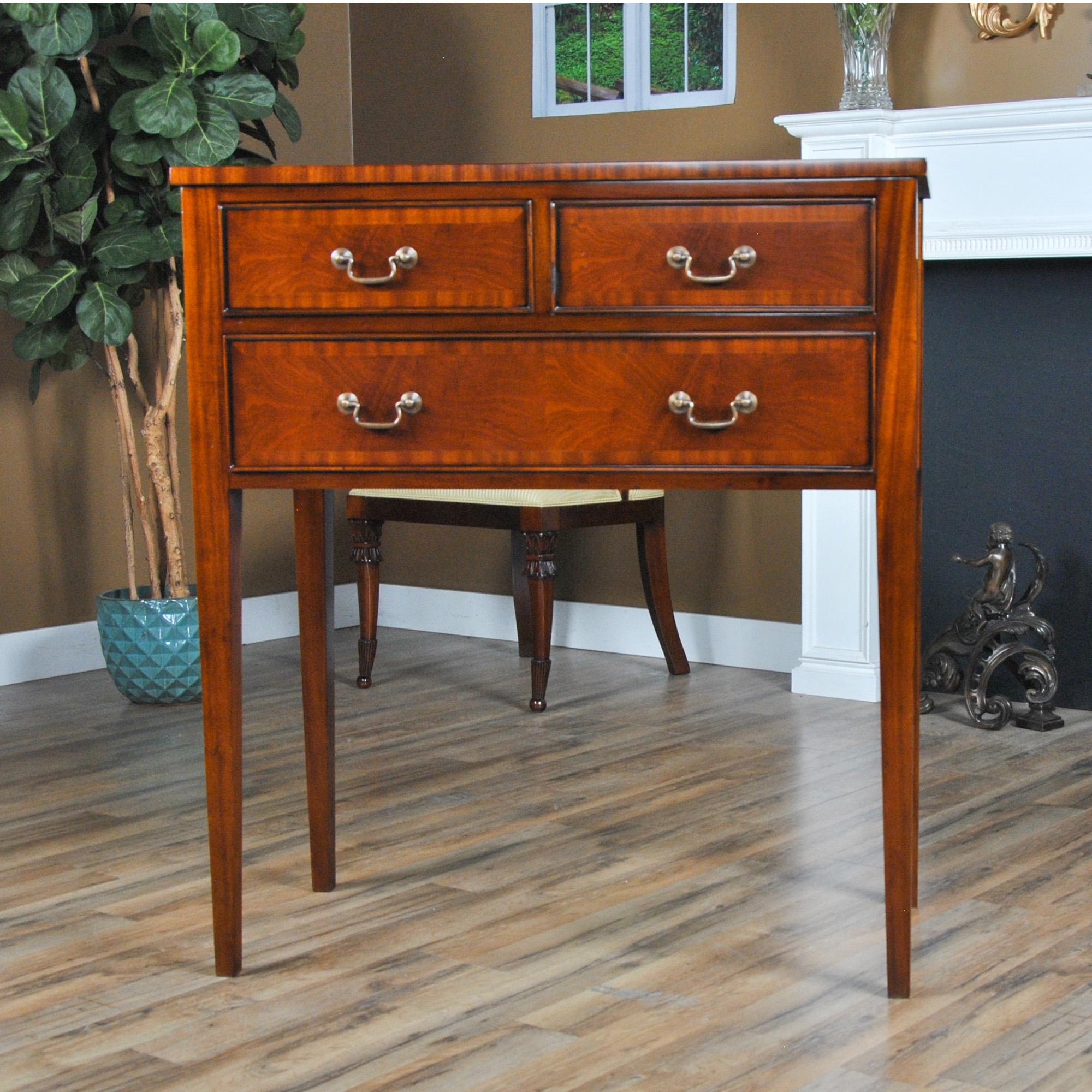 An ideal sideboard for use in smaller spaces in the dining room this version of the Small Federal Mahogany Sideboard is also designed to work with almost any decor. Ideal in a dining room the piece is also suited for use in a living room or hallway.
