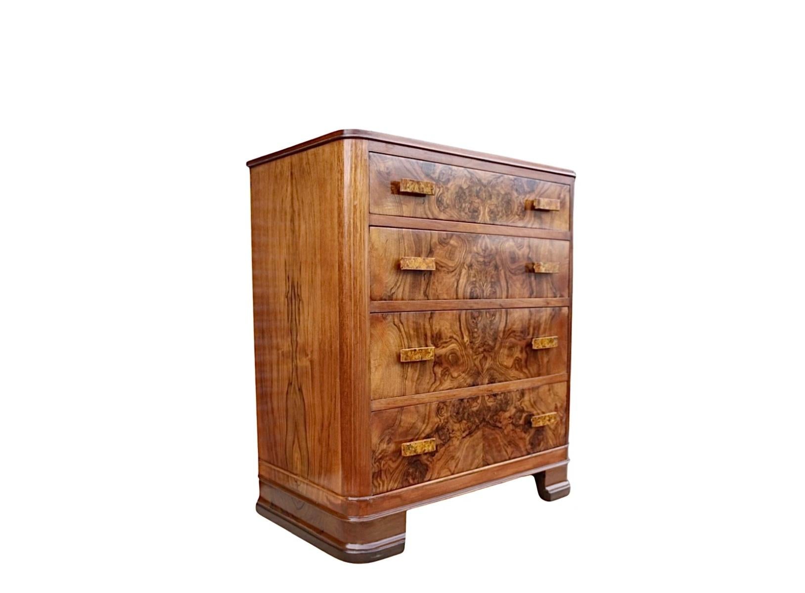 A beautiful small Art Deco Chest of 4 Drawers, highly figured walnut veneers to the drawer fronts and the top and is a gorgeous conker colour. The drawers all run smoothly and provide excellent storage for the size of chest. The handles are an