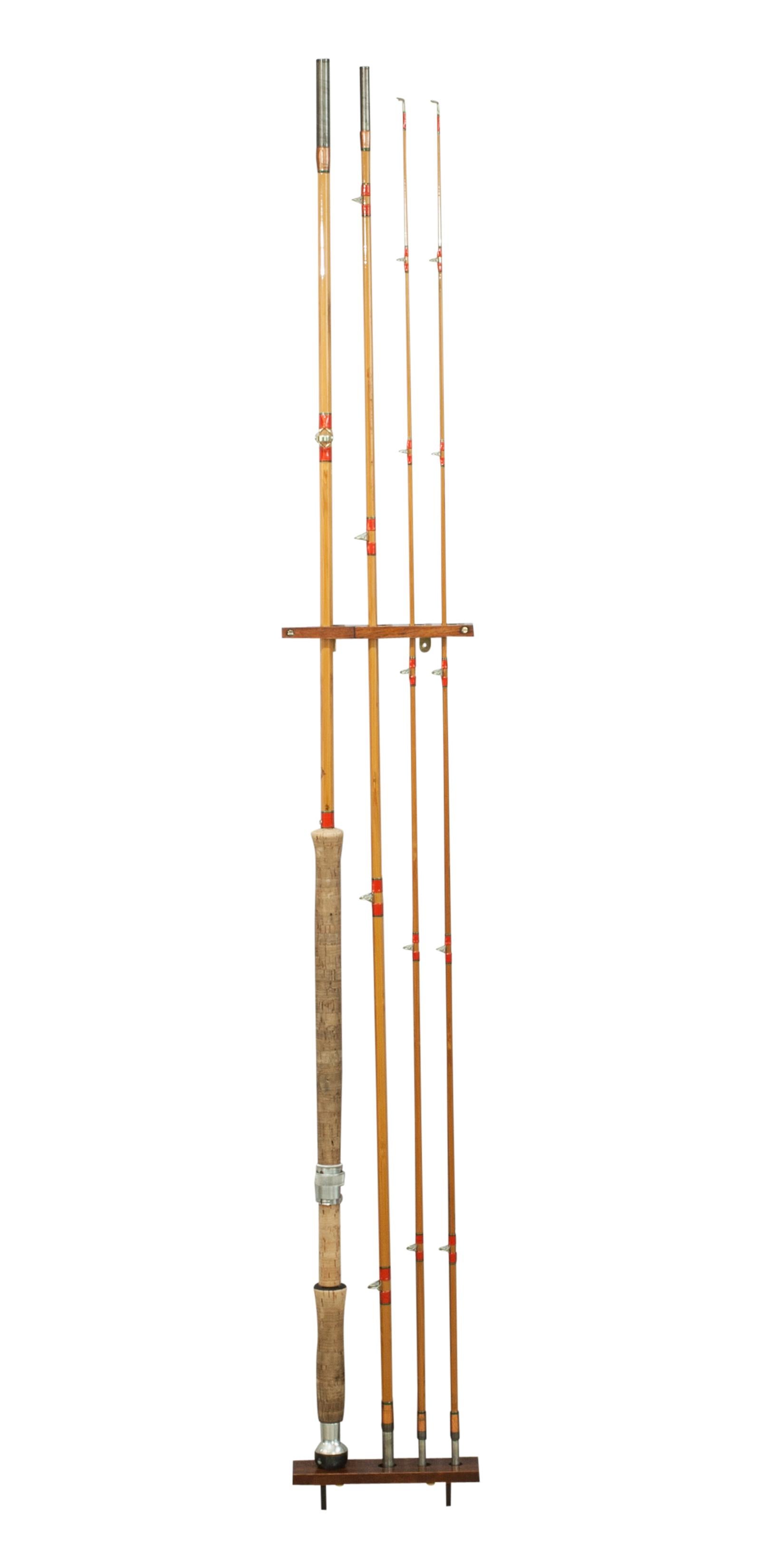 Fishing rod display rack.
A locally made fishing rod display rack. The rack comes in two sizes and this is the smaller of the two. It is made of polished mahogany and will display a split cane fishing rod nicely on the wall in the vertical position