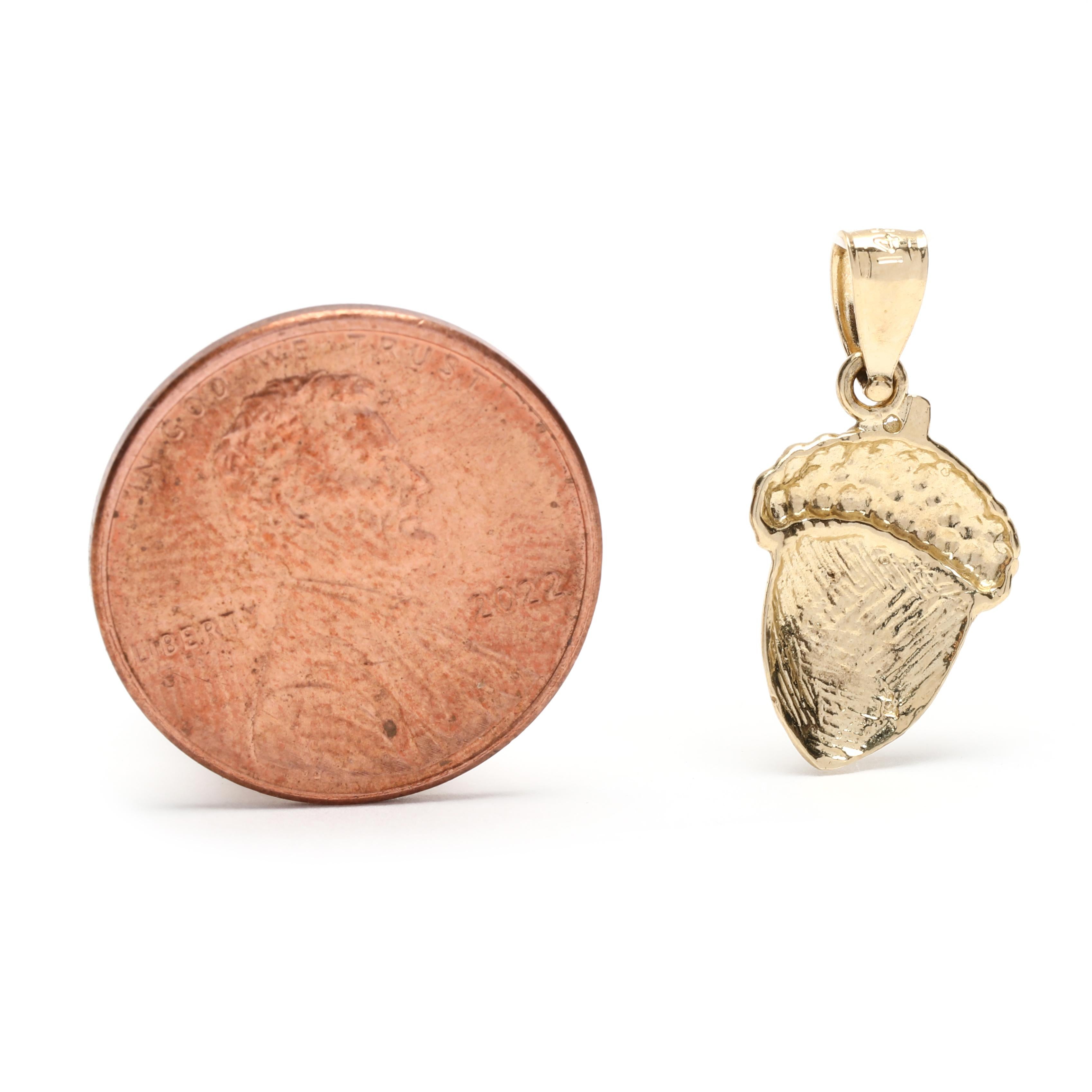 This small flat acorn charm, crafted in 14K yellow gold, is a perfect good luck charm to add to your favorite necklace or bracelet. Our handcrafted charm is 3/4 inch in length and is the perfect size for everyday wear. This dainty charm is a symbol