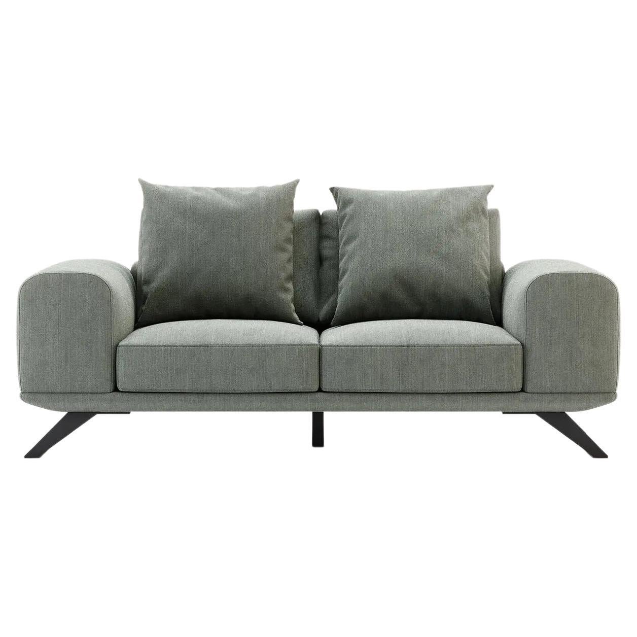 This sofa has a cosmopolitan design that conveys the message of movement and modern flow. A velvet sofa with steel legs that will sit proudly in the middle of a living room. In a unique contemporary style, this sofa is already a