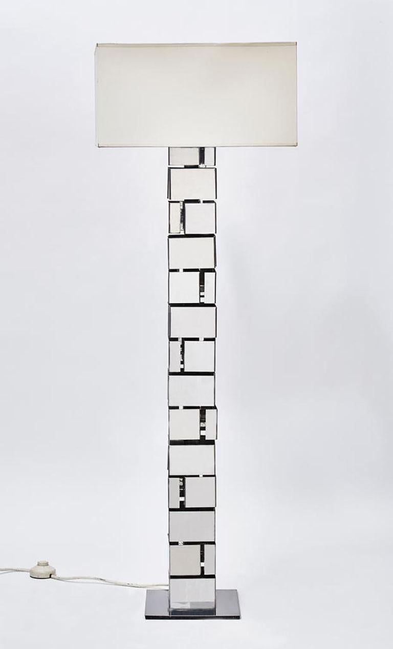 Small floor lamp by Jacques Charpentier, made of a stack of nickeled bent metal sheets forming squares.