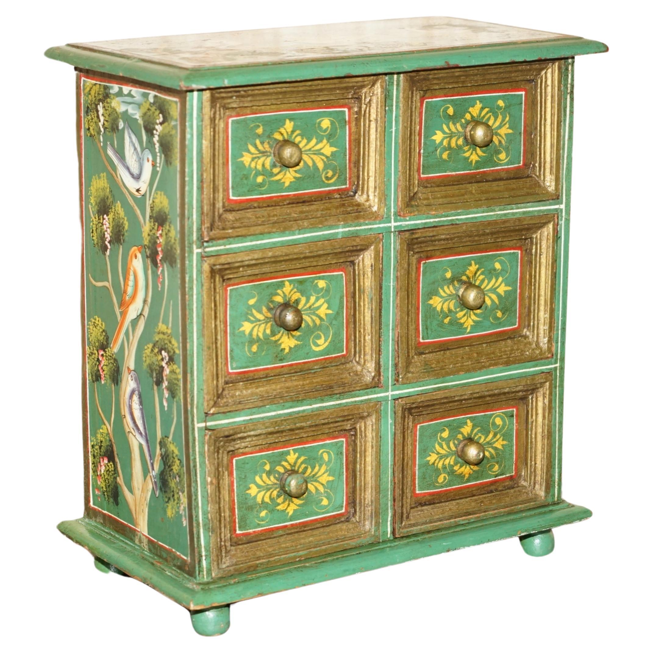 We are delighted to offer for sale this stunning, side table sized chest of drawers which was hand painted with beautiful bords in a floral scene 

A very good looking well made and super decorative piece, this chest looks interesting and important