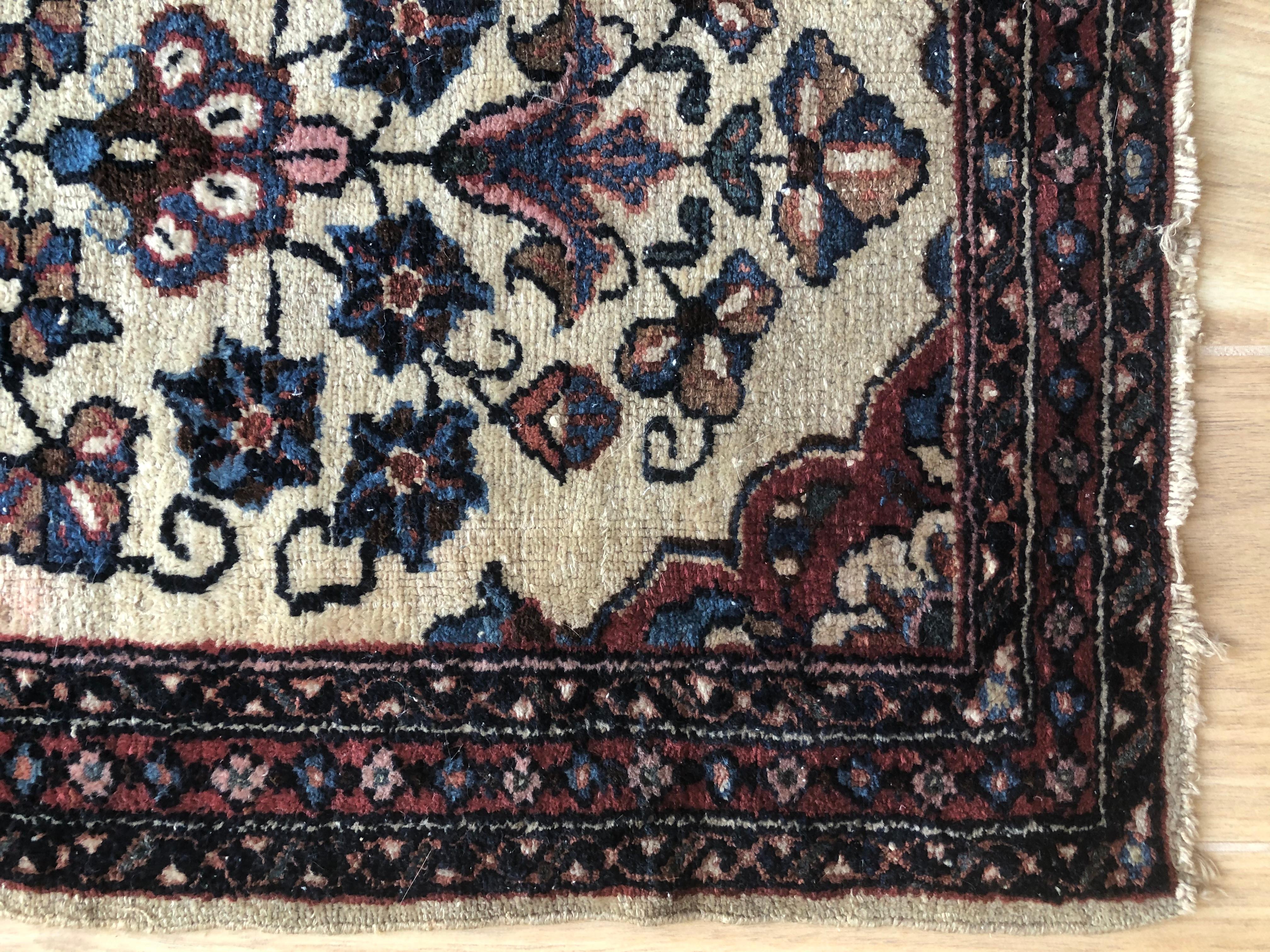 Handwoven one of a kind 19th century floral Persian rug. Beautiful tones of cream and beige with layers of pinks, blue and red. Perfect as an accent rug in living room or bedroom. Bringing a soothing pop of color into any space.