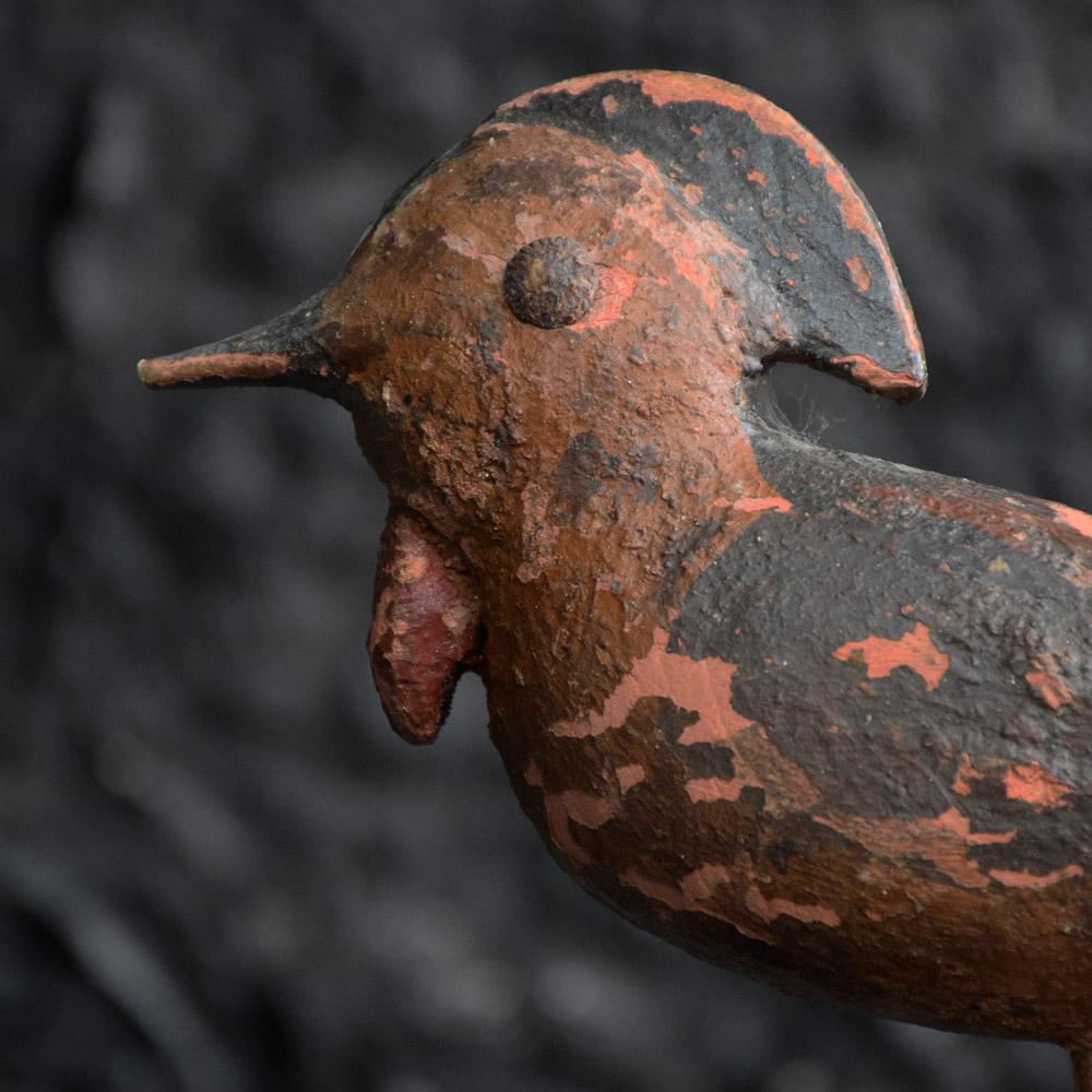 Small Folk Art carved bird figure, circa 1920
We are proud to offer a highly unusual hand carved/painted Folk Art bird figure. Hand carved showing Primitive yet characteristic details. Original hand paint is still present if somewhat aged, brass
