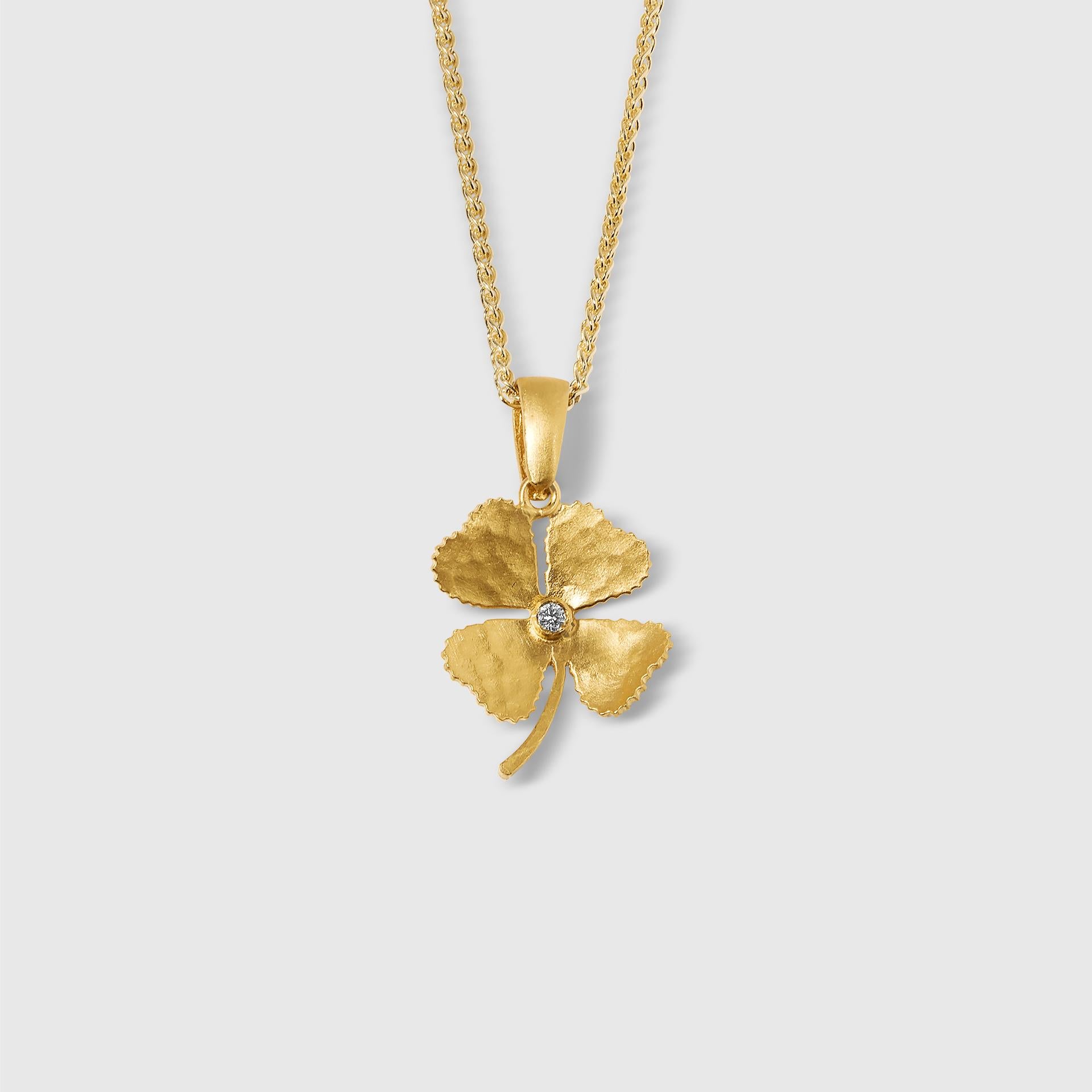 Small, Four Leaf Clover Charm Pendant Necklace with Center Diamond, 24kt Solid Gold by Prehistoric Works of Istanbul, Turkey. Size small, 15.5mm x 26mm, Weighs 3.2g of 24kt gold, diamond is 0.02 ct. Pendant comes with a 16