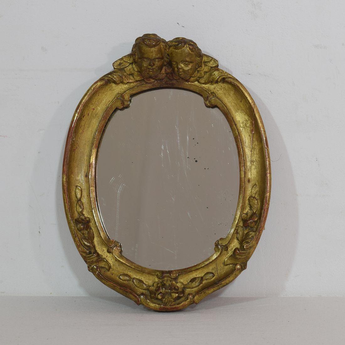 Very nice small Baroque mirror,
France, circa 1750.
Weathered, small losses and old repairs.