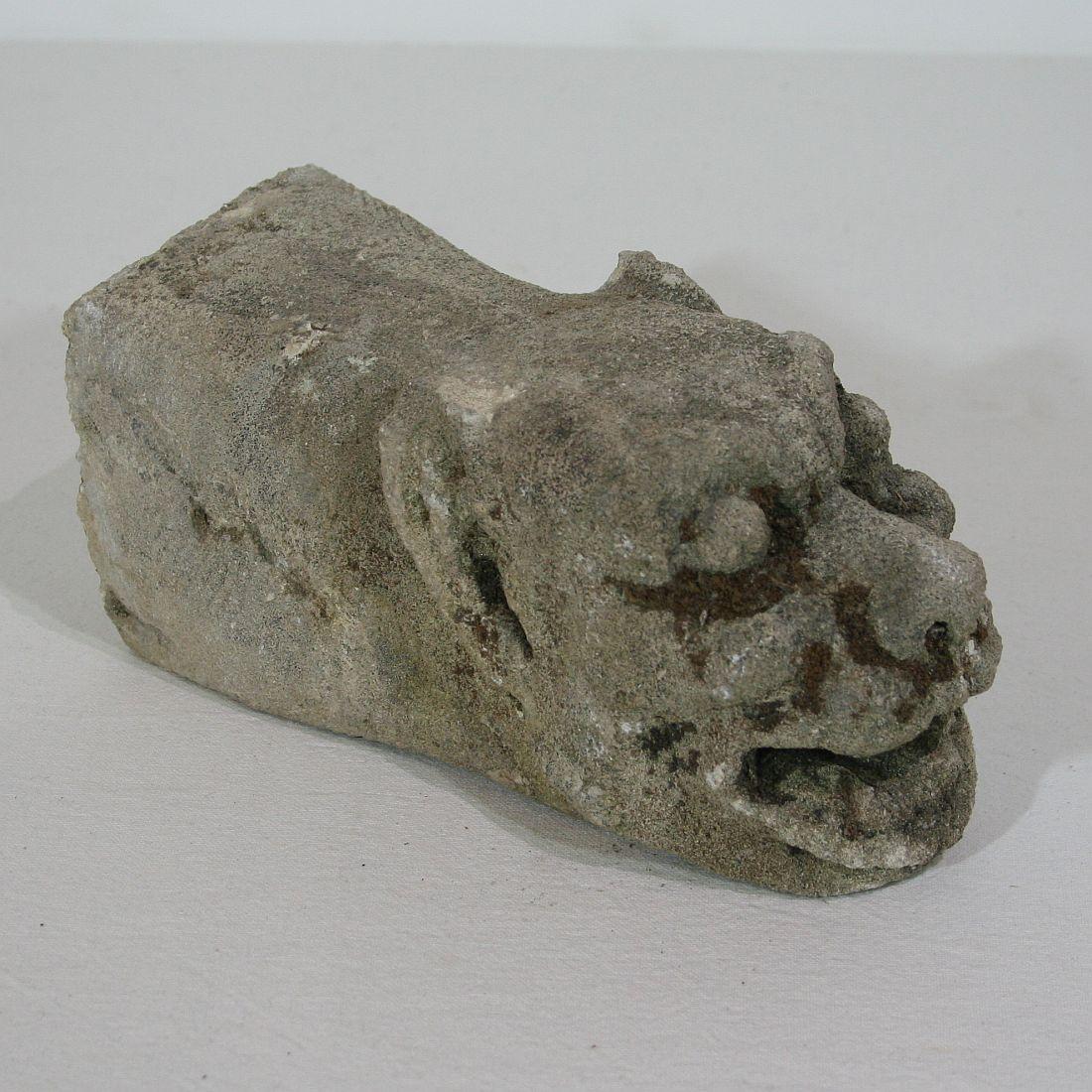 Unique and extremely rare carved stone feathered gargoyle. Great expression 

This gargoyle, a word derived from the French 15th century word 'Gargouille' (throat), is a hybrid, possibly a griffin or a harpie. Being both intentionally grotesque,