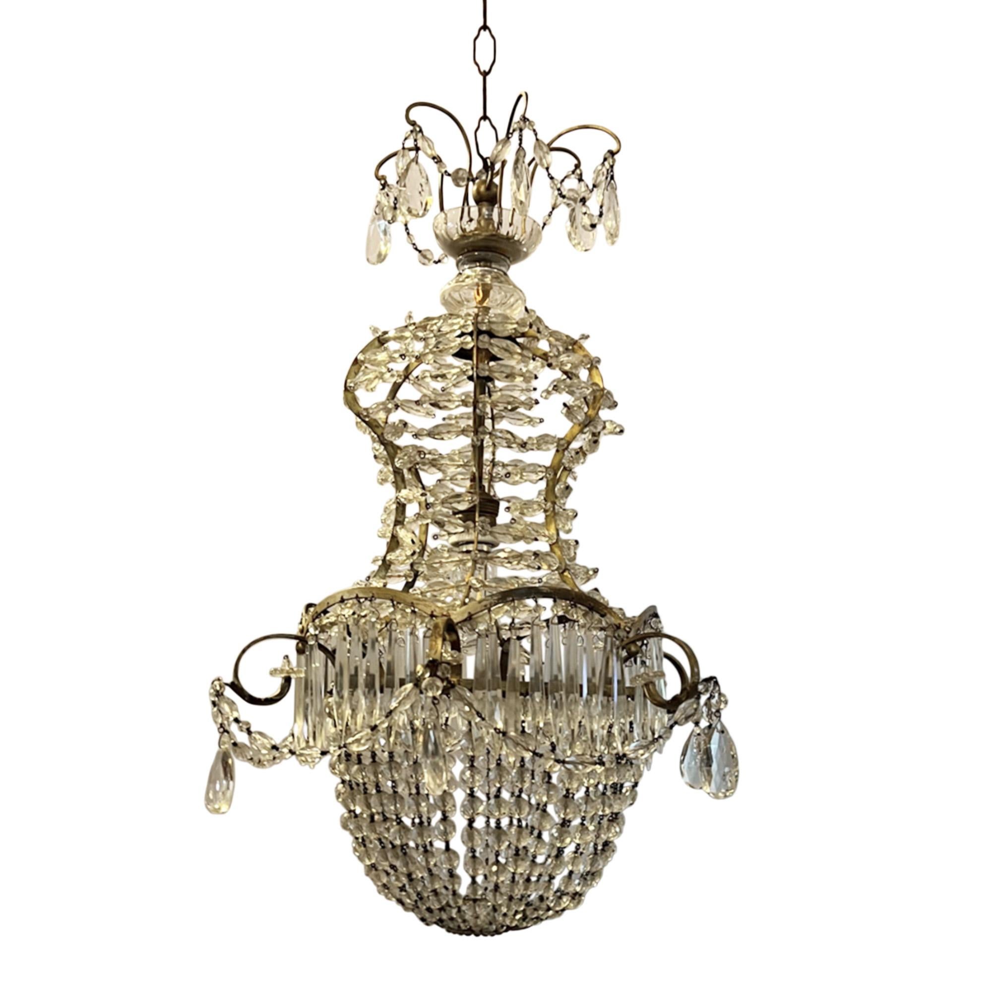 This is a lovely little basket chandelier was made in France in the 1950s.

An elegant design, with lots of detail. Please see the picture of the view from underneath - a great little crystal plaque!

Perfect for a hallway, or a smaller sitting
