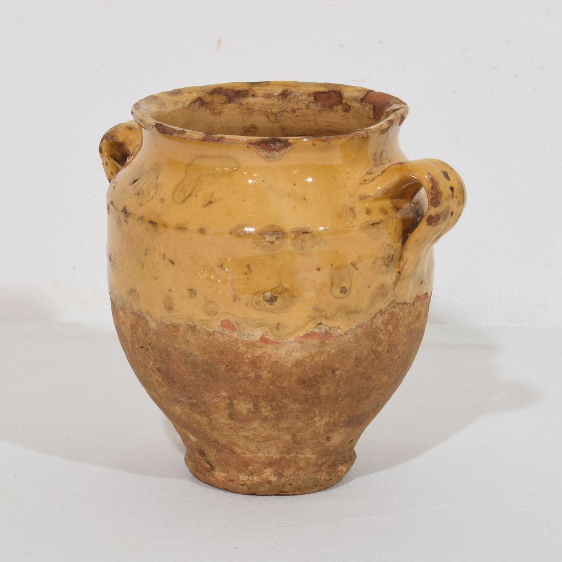  Beautiful small confit jar with its characteristic yellow glaze.
Confit jars were used primarily in the South of France for the preservation of meats such as duck or goose for dishes such as cassoulet or foie gras. The bottom halves were left
