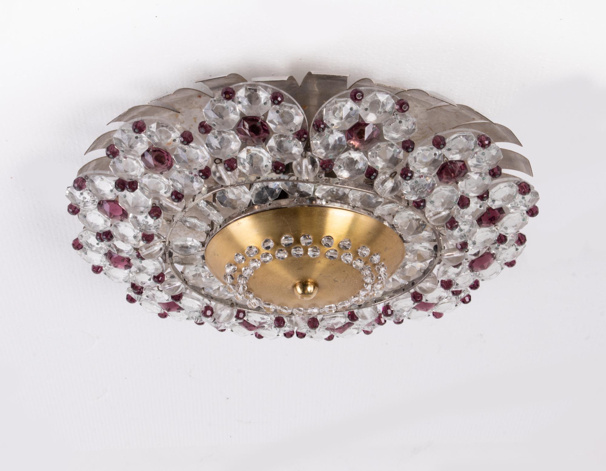 Elegant flush mount ceiling light with amethyst and clear crystals designed in the 1940s in France. 

Style: mid century, modernist. 
Colors: transparent, violet, golden and silver. 
Materials: crystal, brass and aluminum. 
Country of origin:
