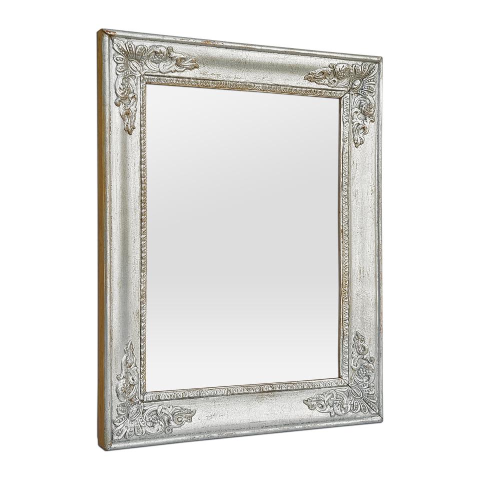 Antique French Restoration-style patinated silvered wood mirror (circa 1890) with stuccoed decoration of palmettes in the corners and rais-de-cœur around the edges. Antique frame width: 5.5 cm / 2.16 in. Modern glass mirror. Antique wood back.
