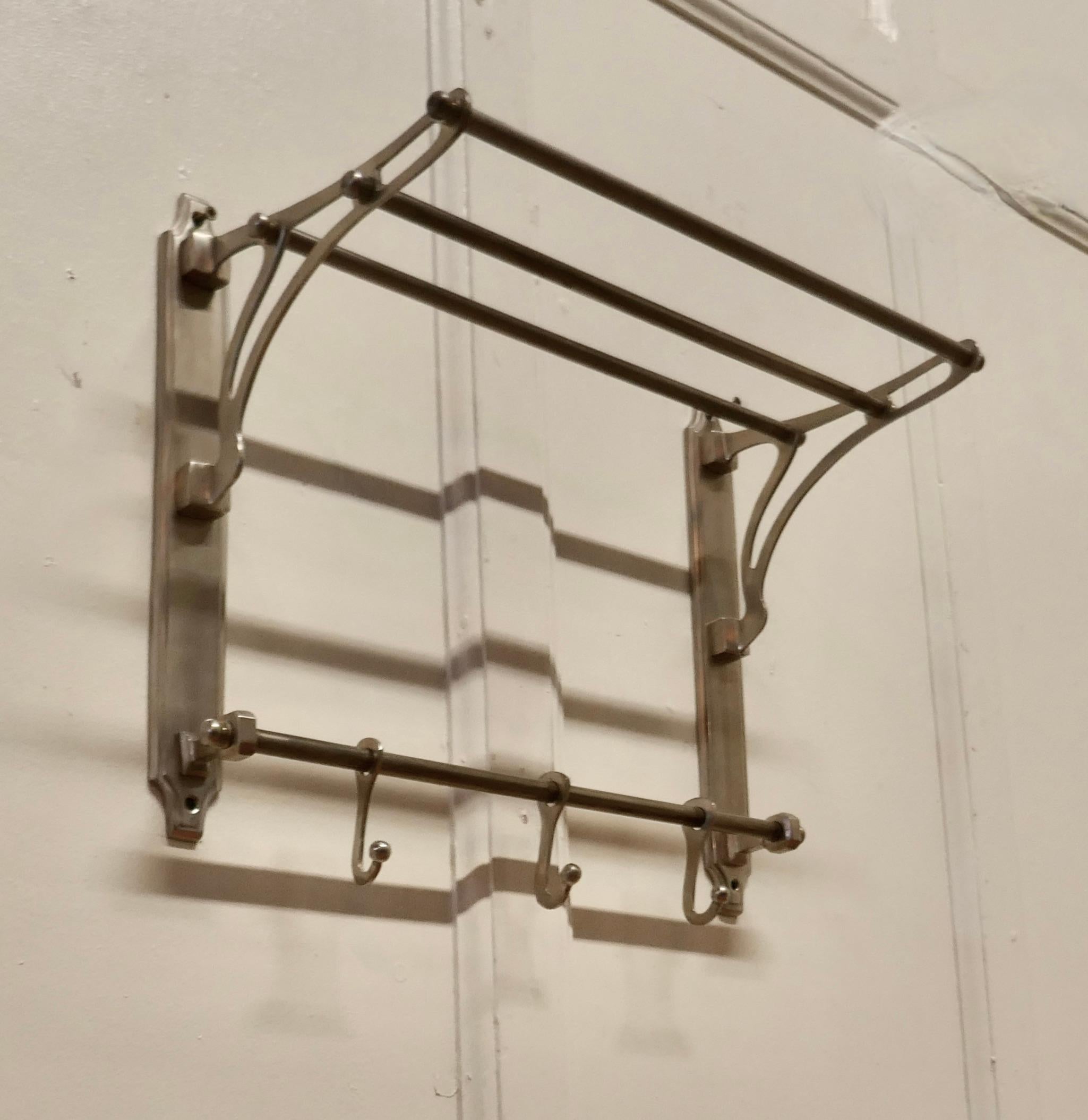 Small French Art Deco hat and coat rack, pullman railway train style

 This Art Deco style hat and coat rack has 3 sliding hooks and an upper railed shelf 
Racks like these were used on French railway trains just like the ones on “the Orient
