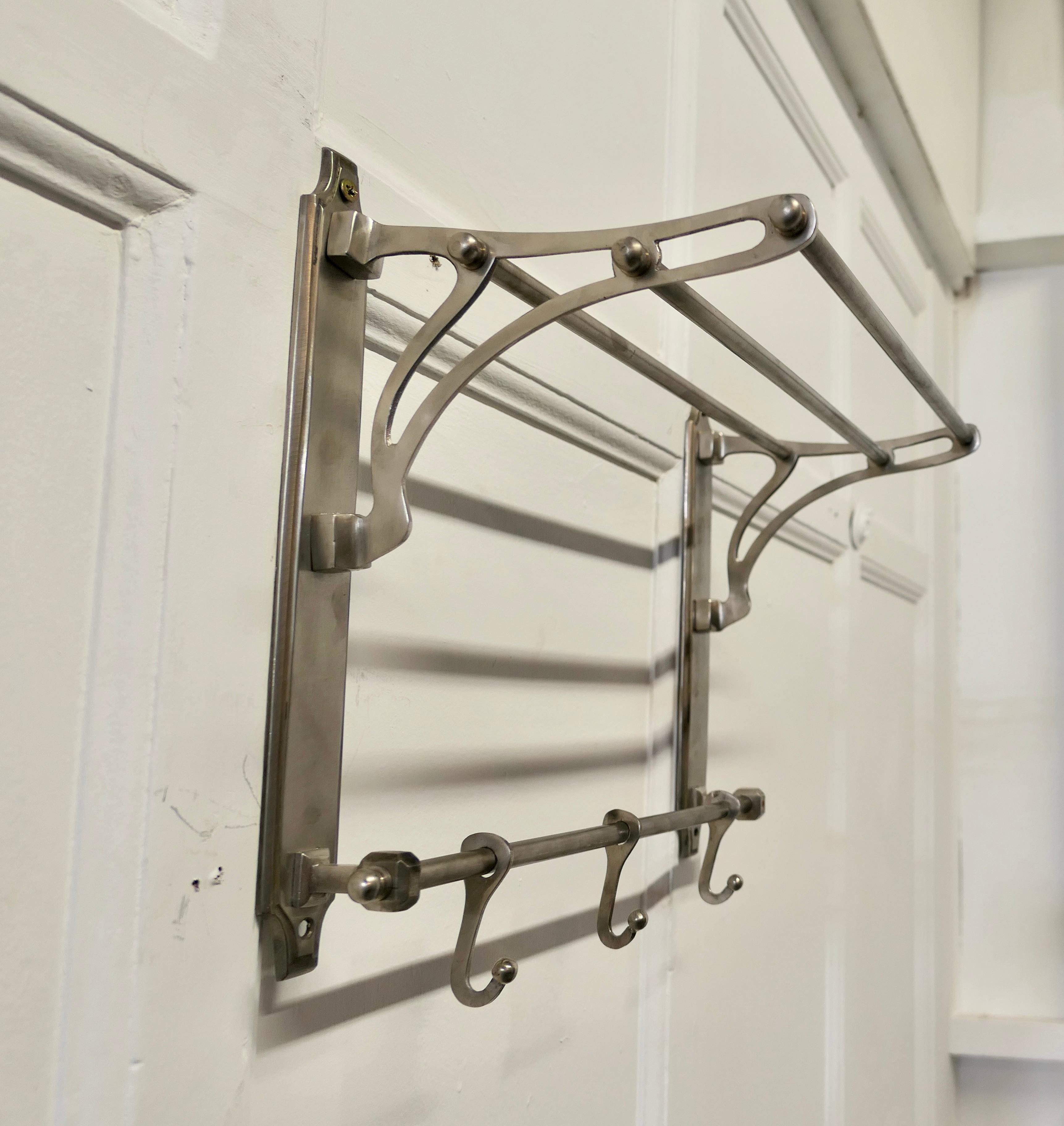Small French Art Deco hat and coat rack, Pullman Railway Train style.

 This Art Deco style hat and coat rack has 3 sliding hooks and an upper railed shelf 
Racks like these were used on French railway trains just like the ones on “the Orient