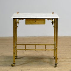 Small French brass table with marble top, circa 1910
