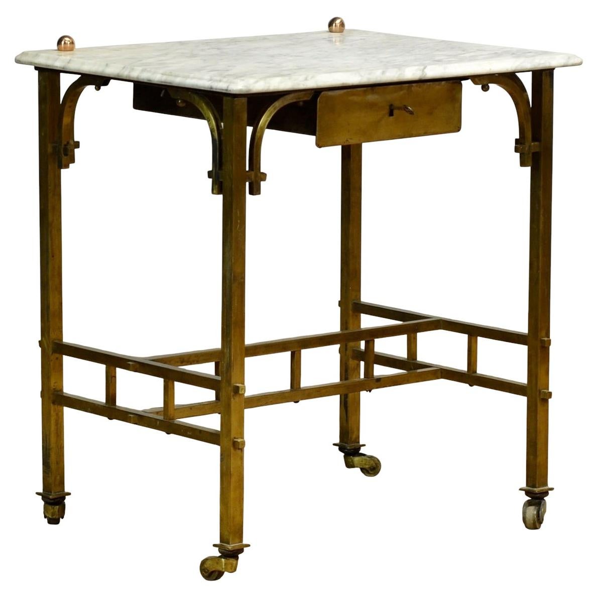 Small French brass table with marble top, circa 1910