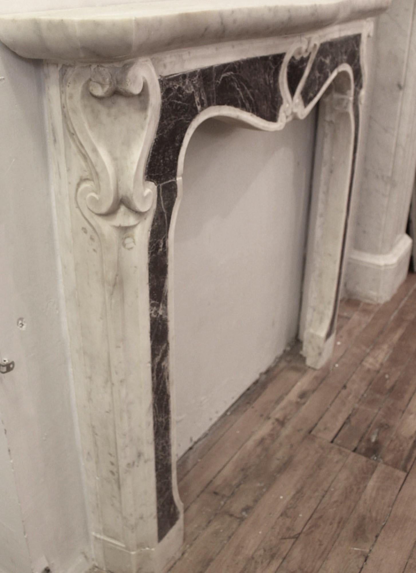 20th Century Small French Carved Marble Mantel Center & Side Scroll Motif For Sale