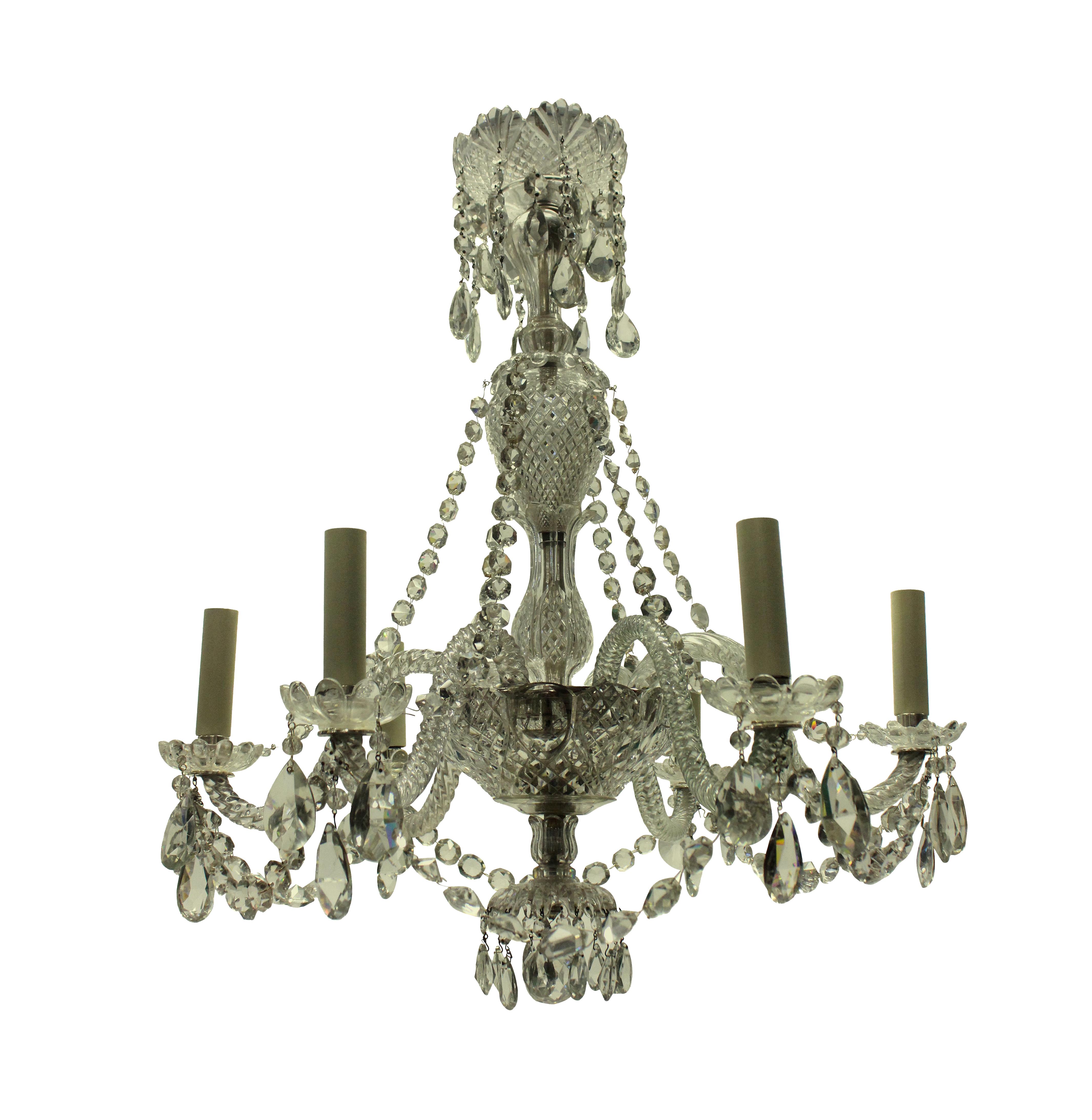 A French cut-glass chandelier of smaller proportions for a lower ceiling. The glass of good quality.