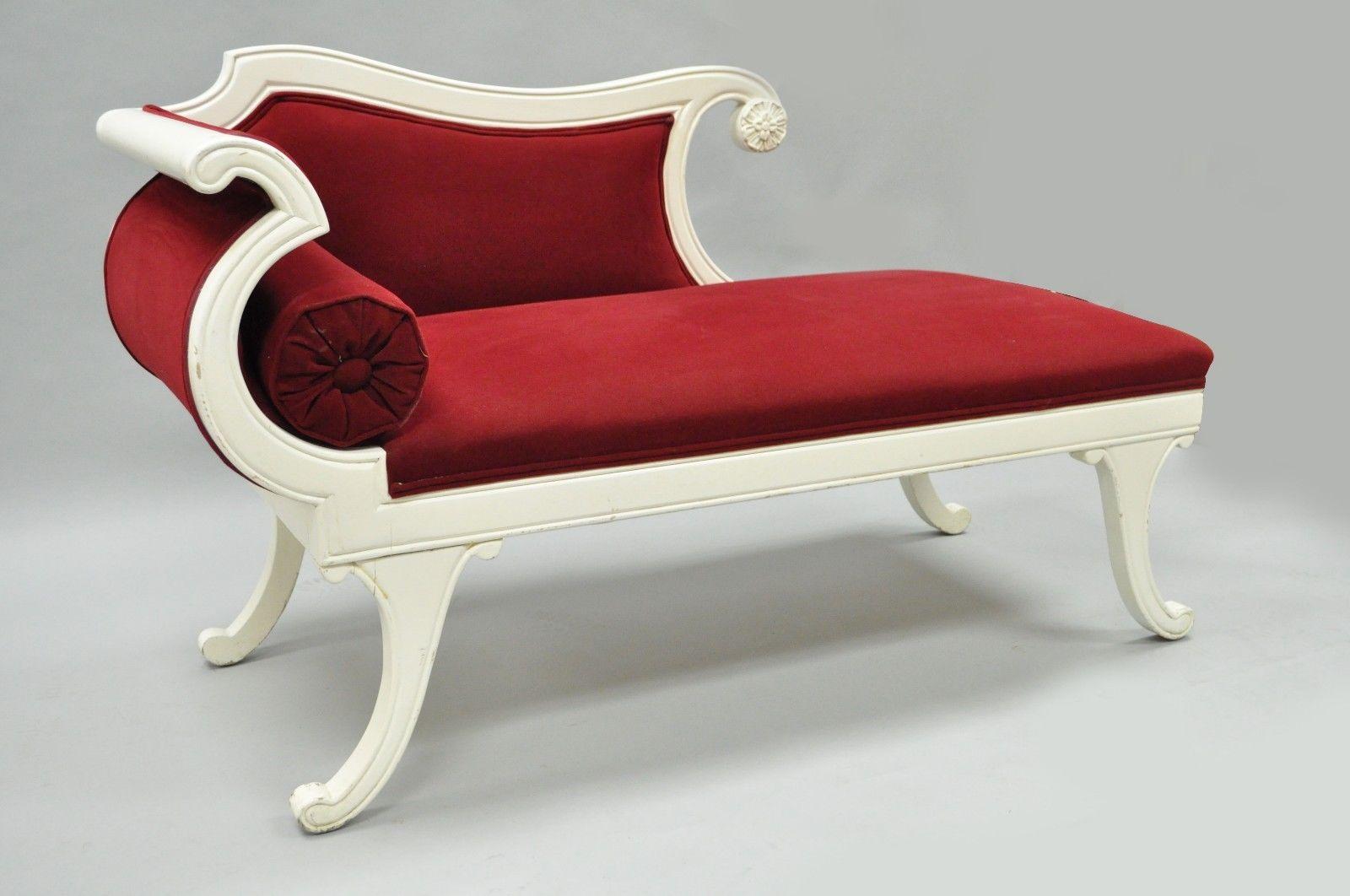 Small Vintage French Empire Style Carved Wood chaise longue. Great for use as a child's chaise longue or unique decorative item. Item features Solid Carved Wood Frame, Plush Red Upholstery, White painted Finish, Round Loose Pillow, Very Elegant