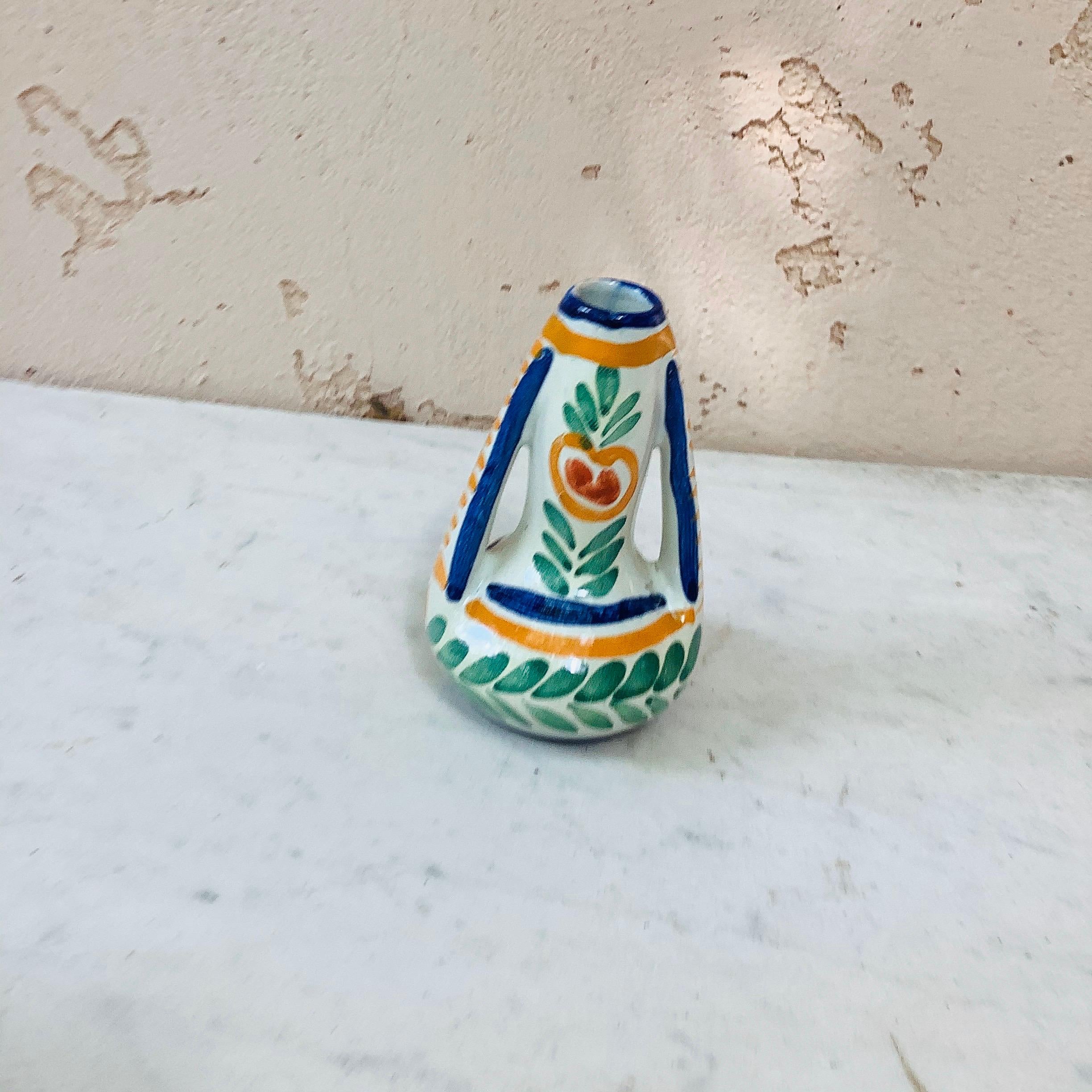 French faience vase with handles decorated with a Breton figure signed 