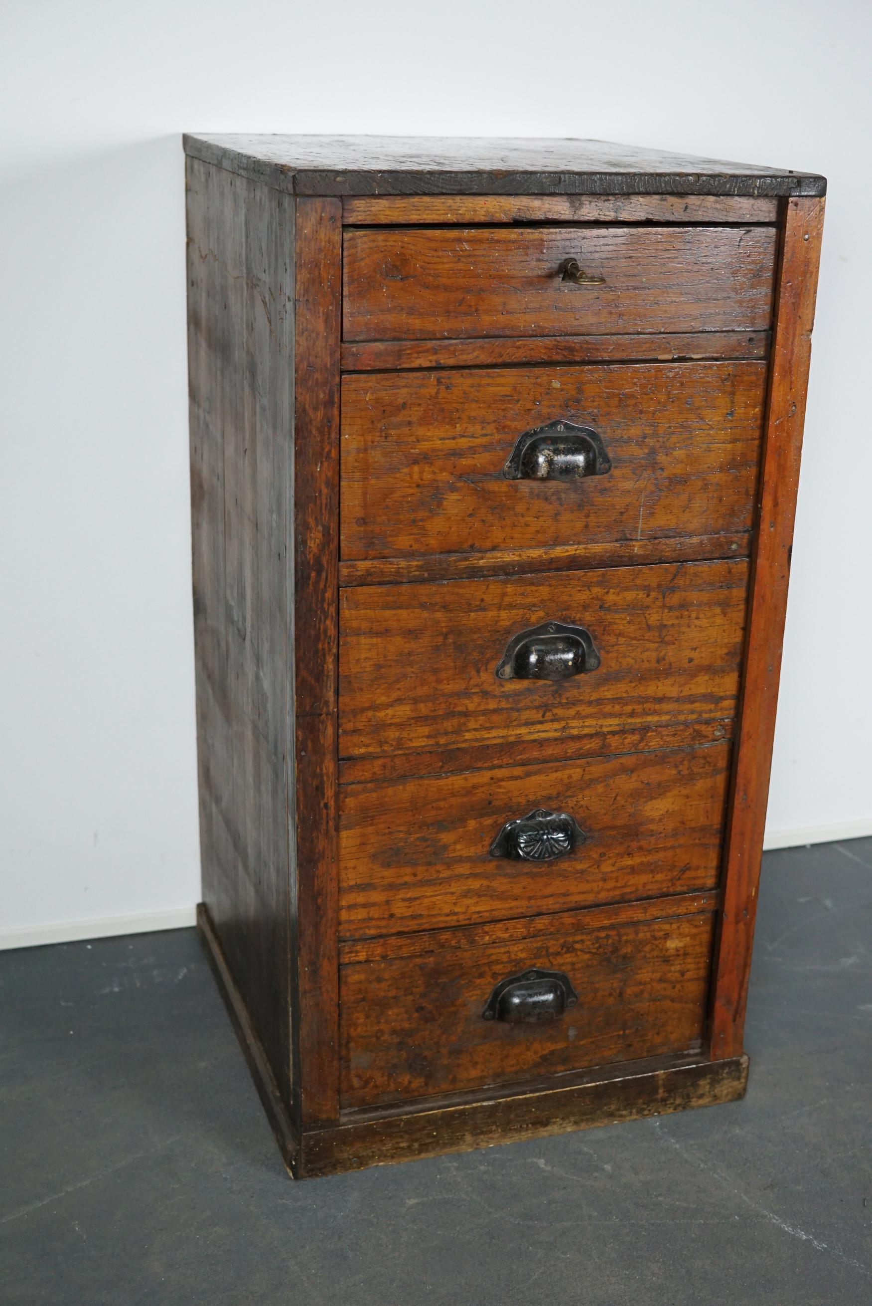 This French workshop cabinet was made circa 1950s in France. It features 5 decent sized drawers with metal cup handles. It is made from pine and oak.