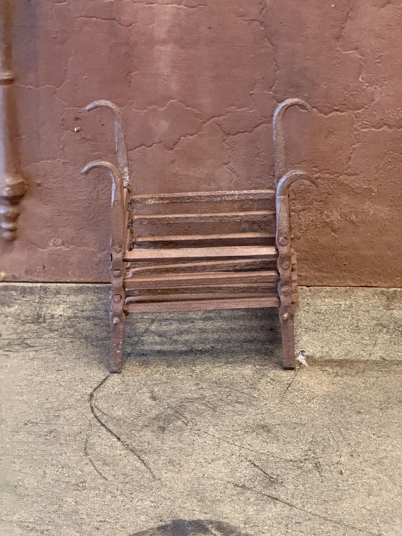 19th century French Louis XIV Period fireplace grate. The fire grate has been made of wrought iron. The grate is in a good condition and is fully functional.