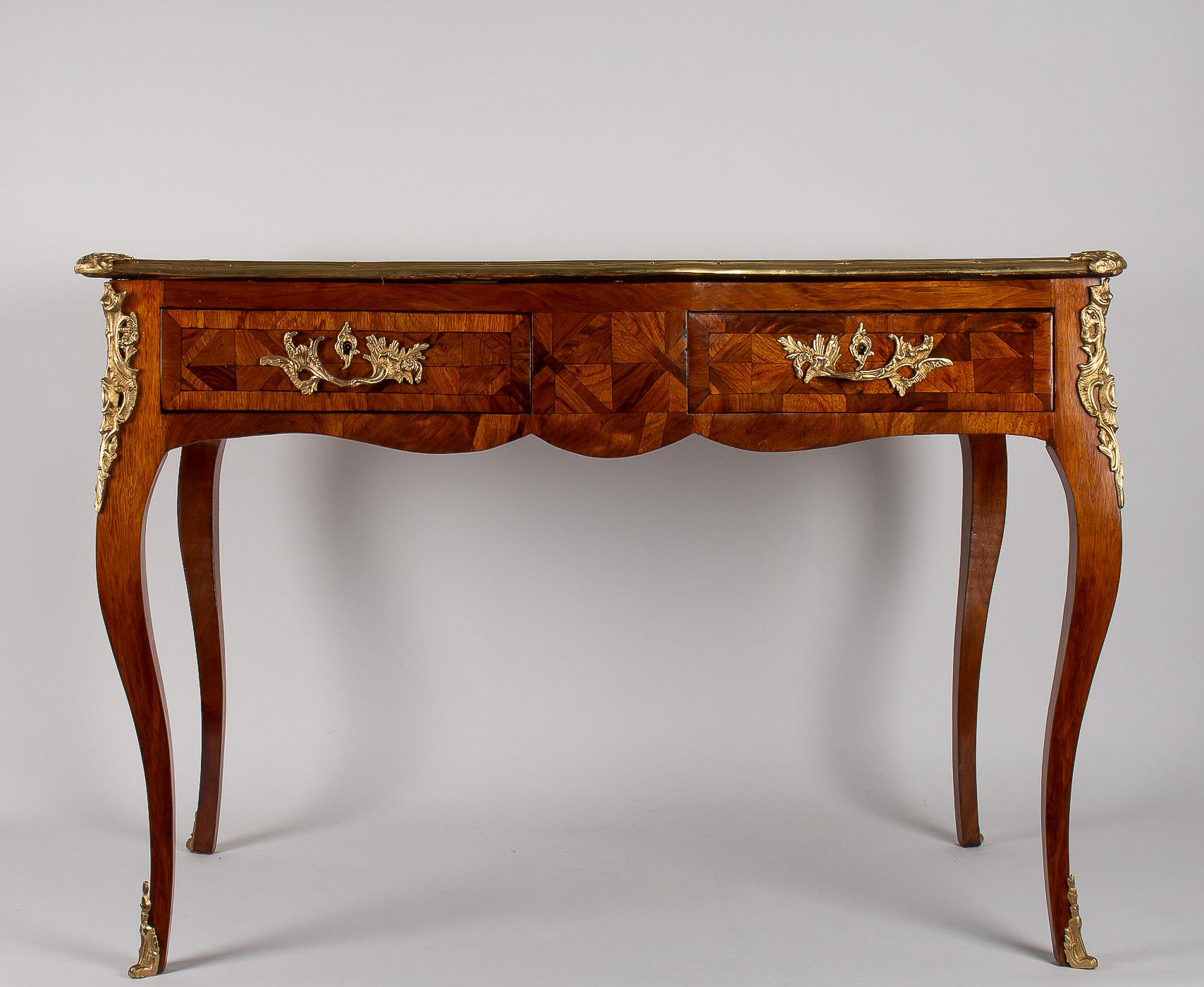 Small French Louis XV style marquetry bureau plat, circa 1820-1840.

Elegant and beautiful rectangular form small desk, called “Bureau Plat” in a Classic French Louis XV style, walnut, and veneer, raised on four cabriole legs, with two drawers and
