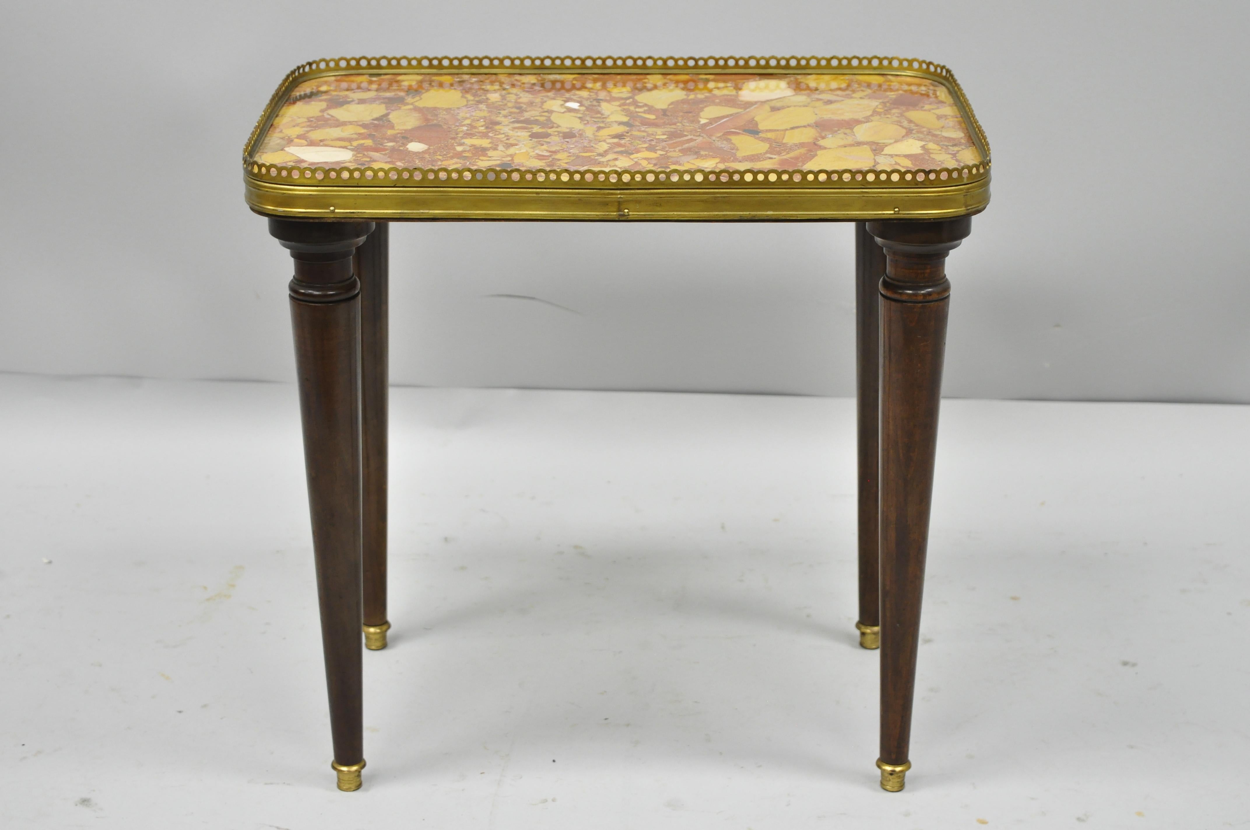 Small French Louis XVI Directoire style rouge marble-top accent table. Item features rouge marble top, brass gallery, tapered legs, brass feet, stamped 