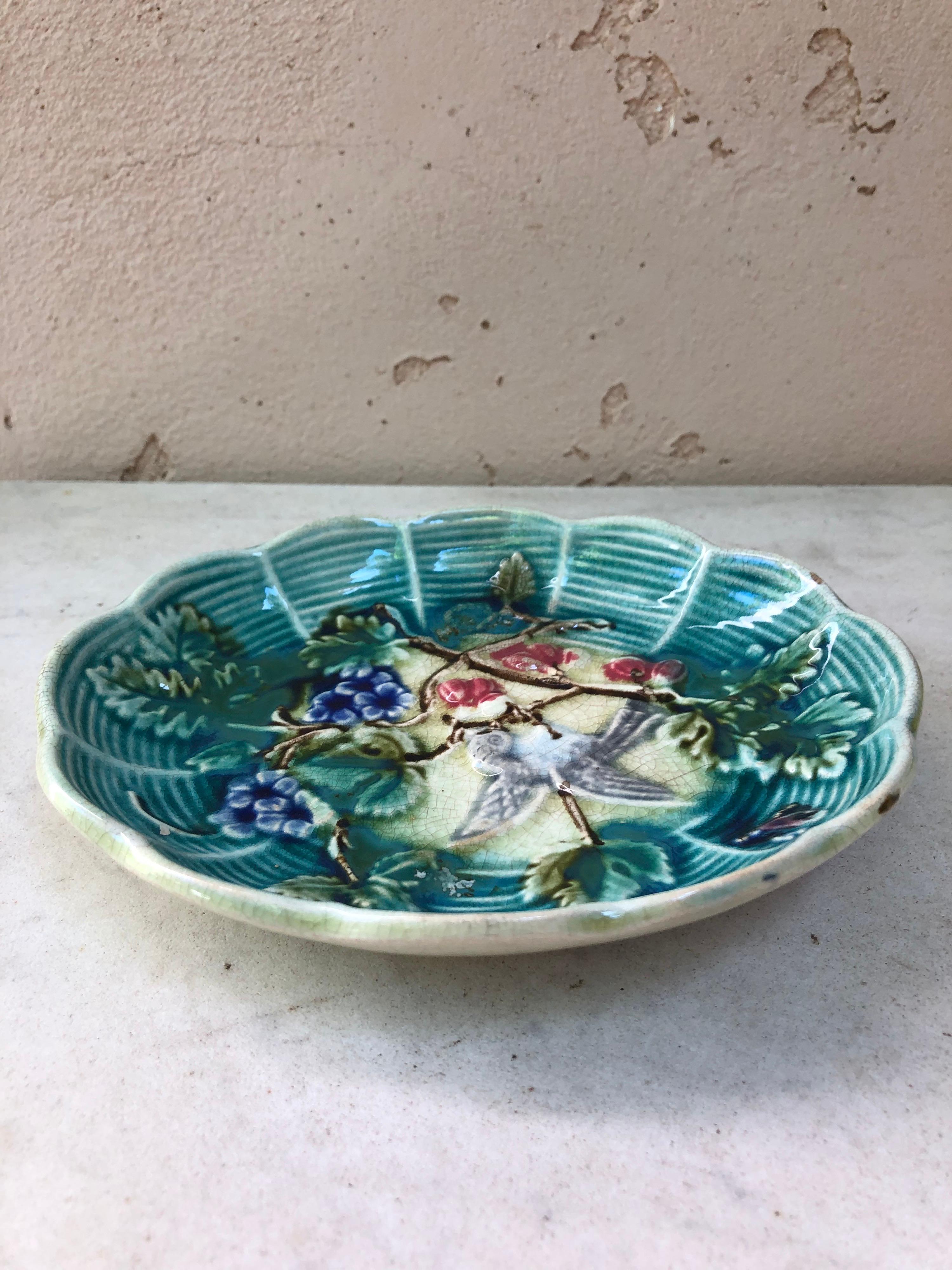 Small French Majolica dish with bird and flowers Onnaing, circa 1890.