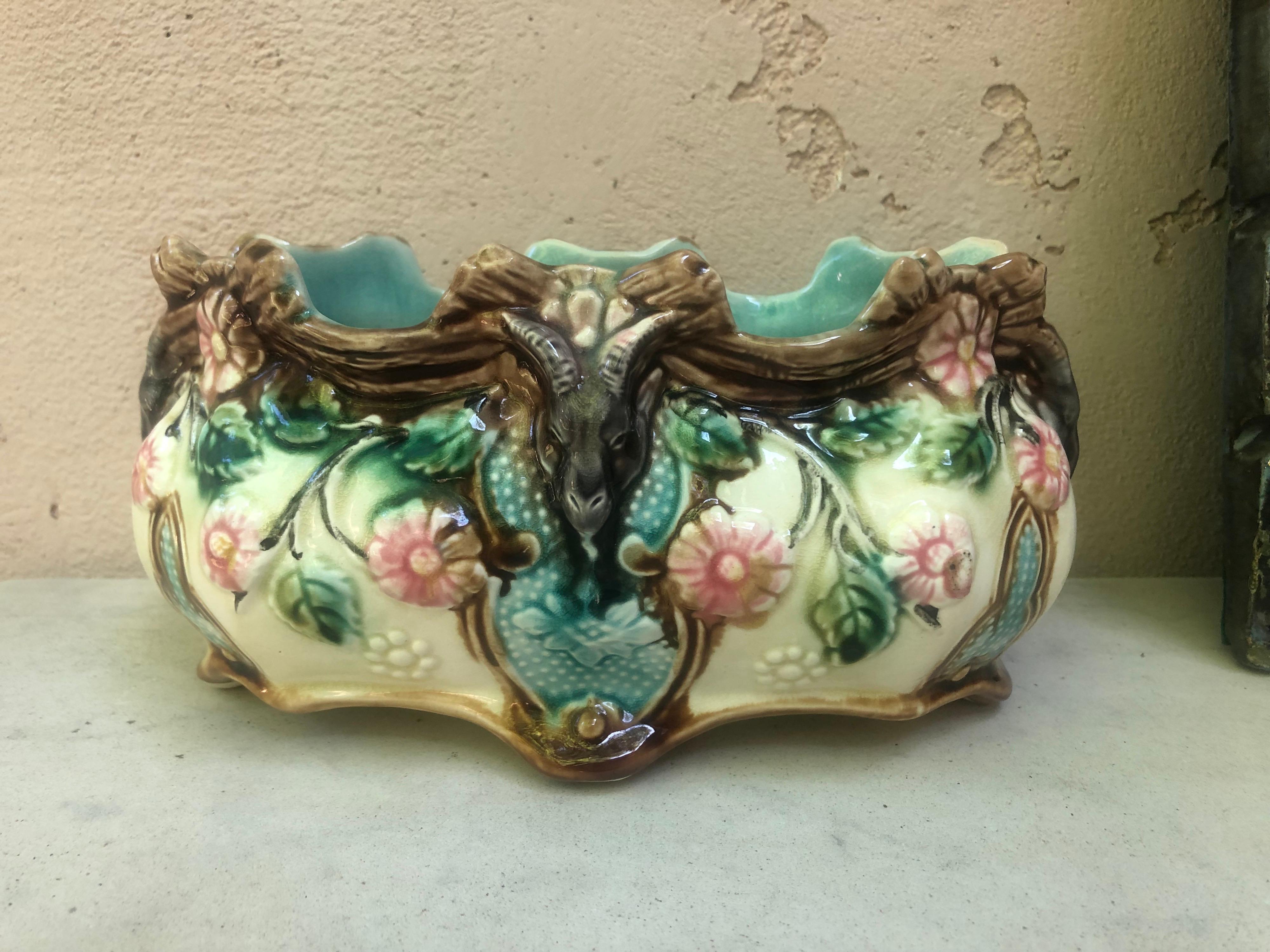 Small French Majolica jardiniere Onnaing, Circa 1890.
Decorated with ram heads and pink flowers.