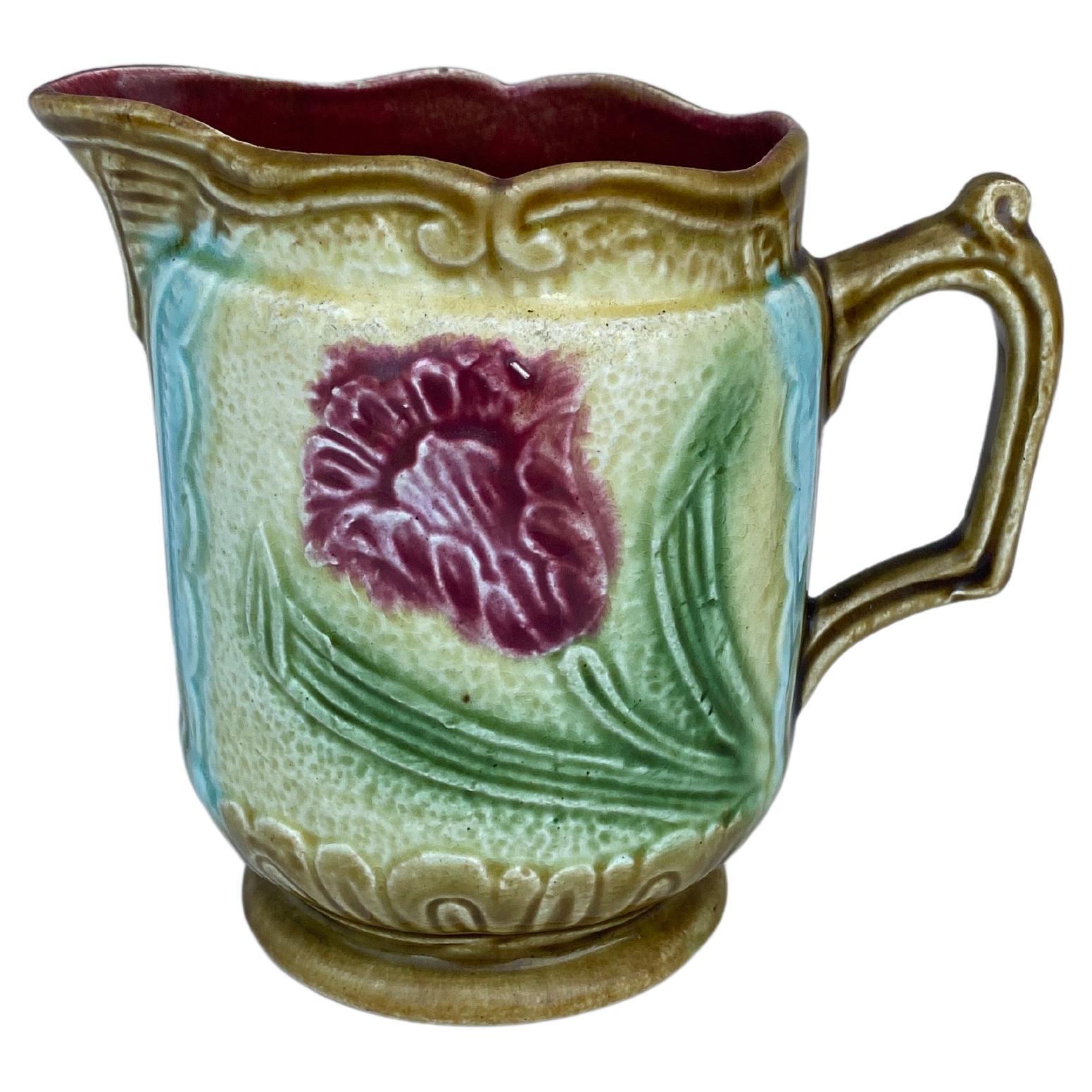 Small French Majolica Pitcher Creamer decorated with pink flowers circa 1900.