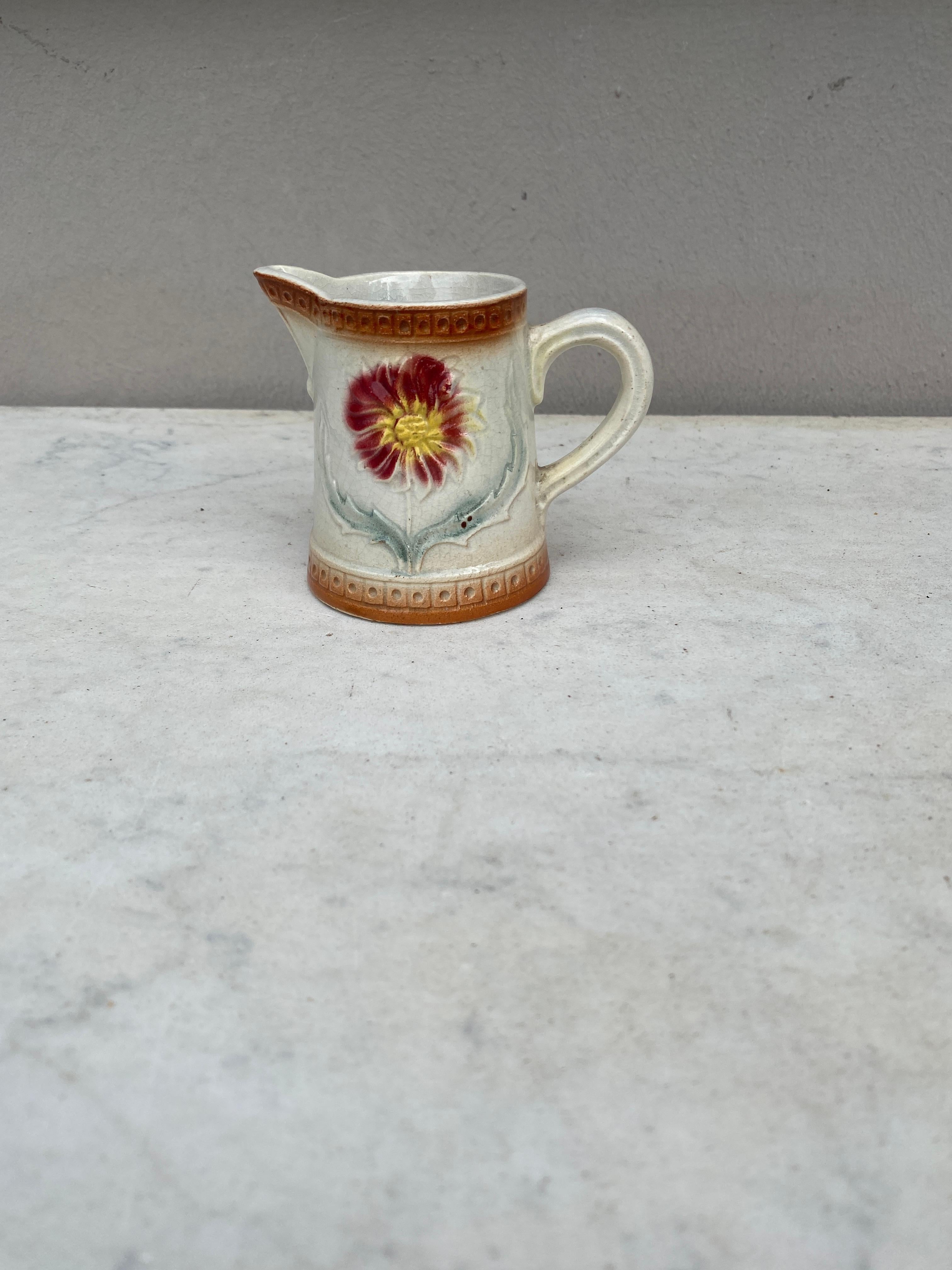 Charming Small French Majolica Pitcher Creamer decorated with a red flower.