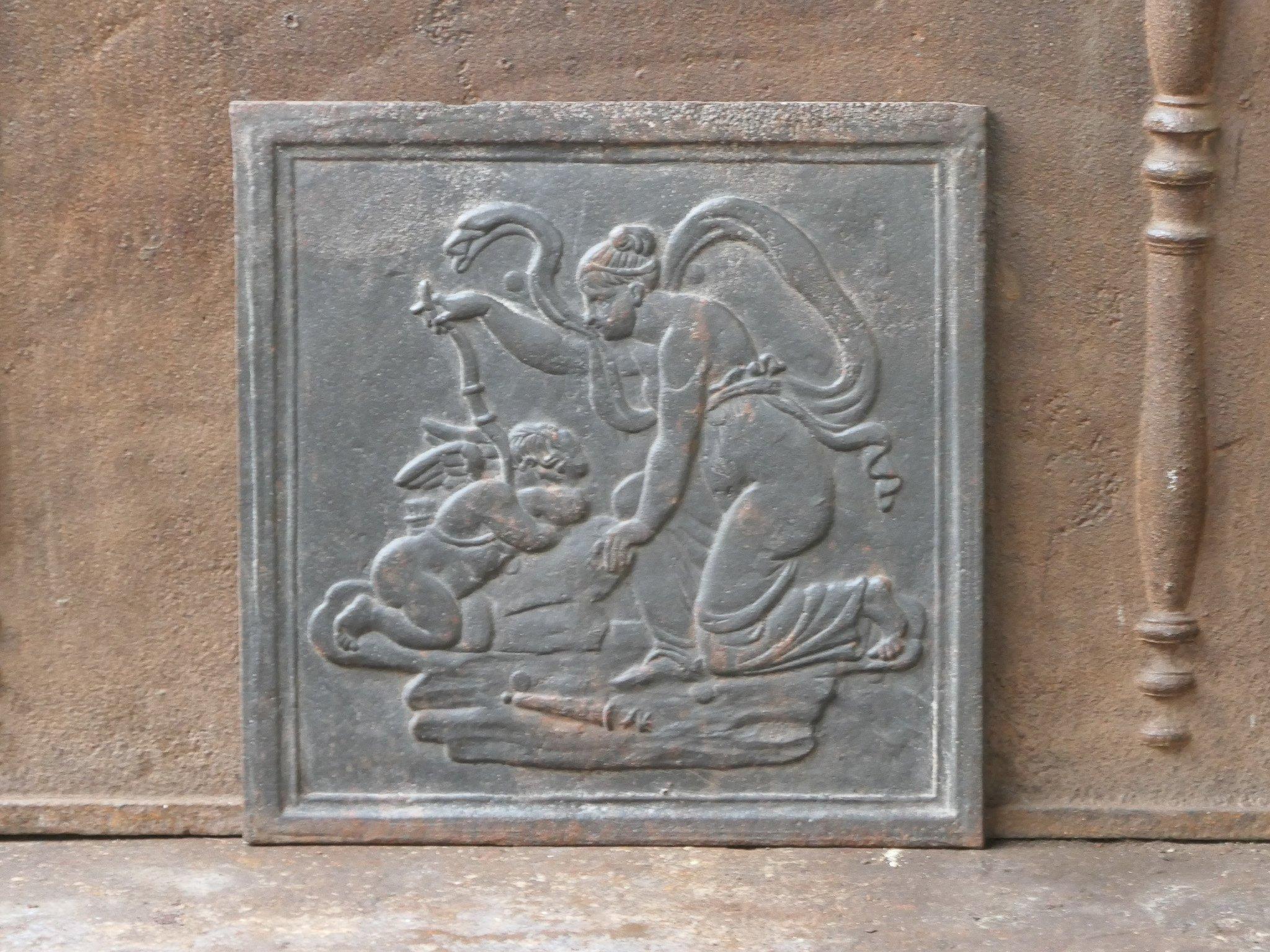 19th century French Napoleon III period fireback with the goddess Diana and a cupid. Goddess of hunting, also protector of animals of the forest, especially the young animals. She experienced great pleasure in hunting, but took care that she did not