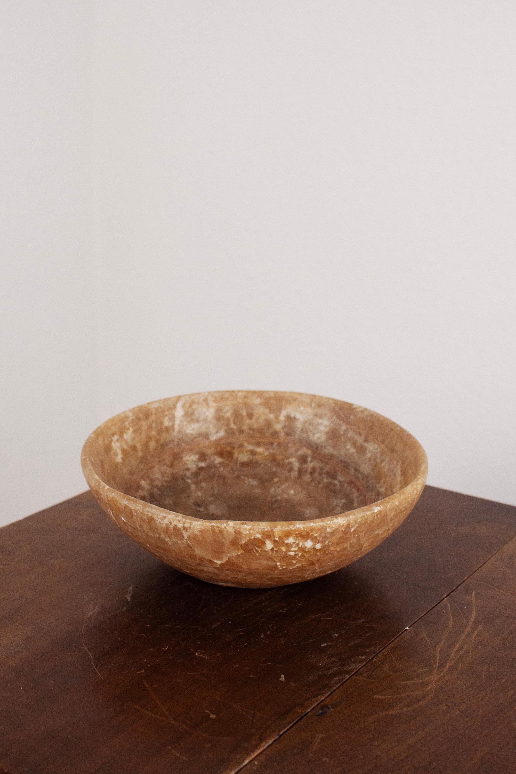 A small decorative stone marble bowl in a beautiful natural brown-beige tone.
This elegant piece showcases the organic beauty of marble with its subtle color variations and smooth finish. Perfect for holding or displaying small objects, it makes a