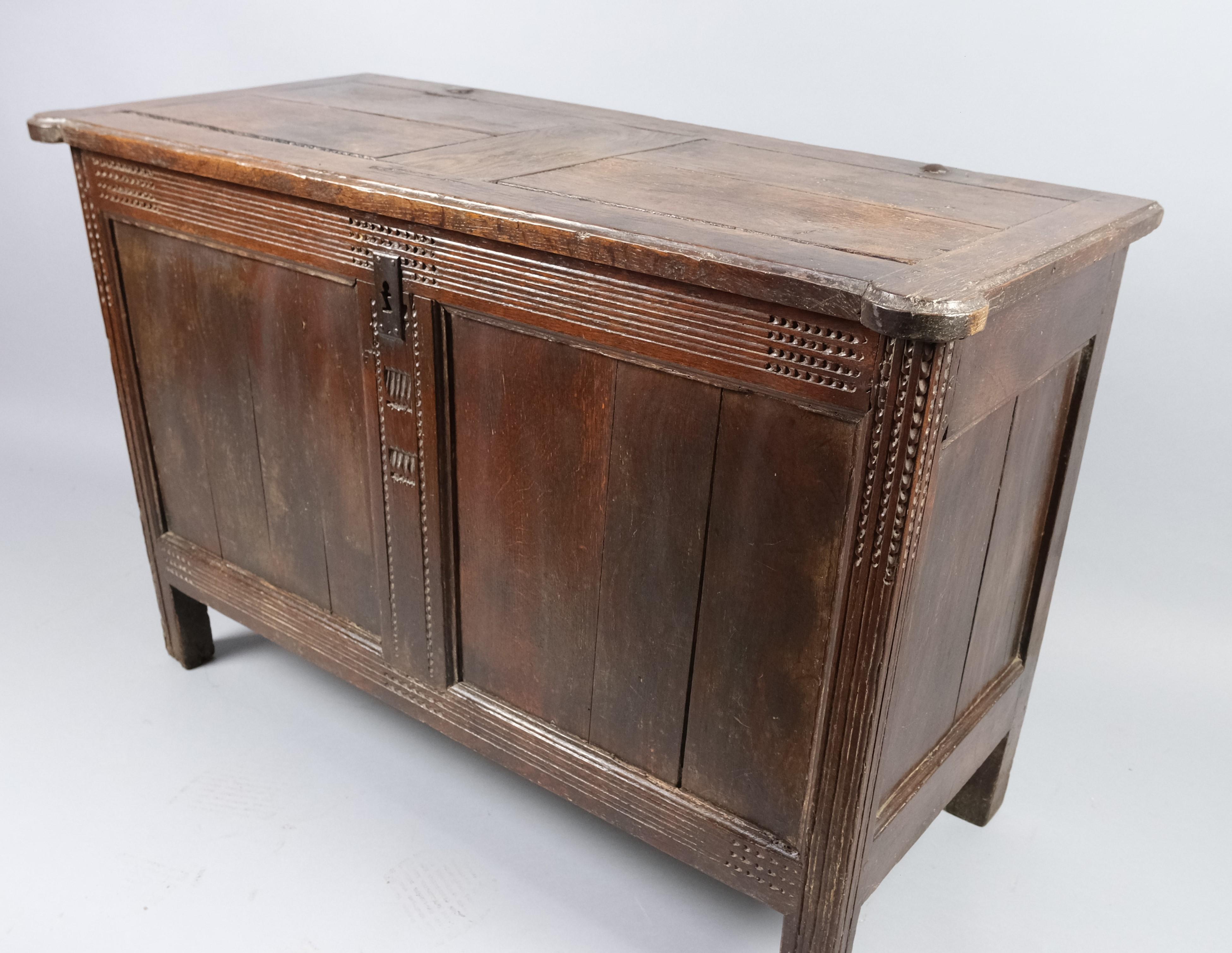 Hutton-Clarke Antiques takes pride in presenting an exquisite French antique oak coffer, dating back to approximately 1750. This charming piece is attributed to the Caen region of France and stands as a testament to the craftsmanship of its time.