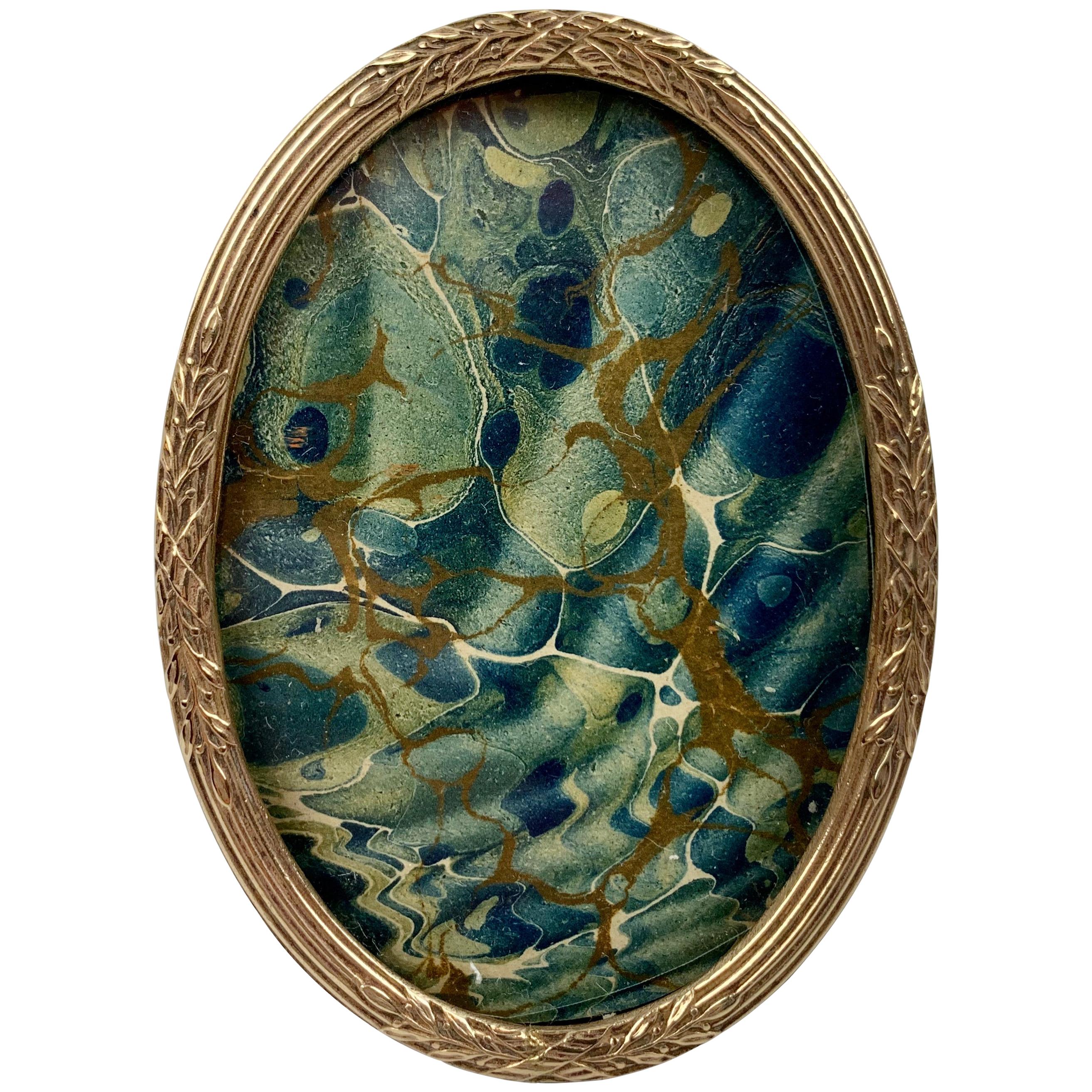 Small French Oval Louis XVI Gilt Frame with Crossed Ribbons Over Reeds