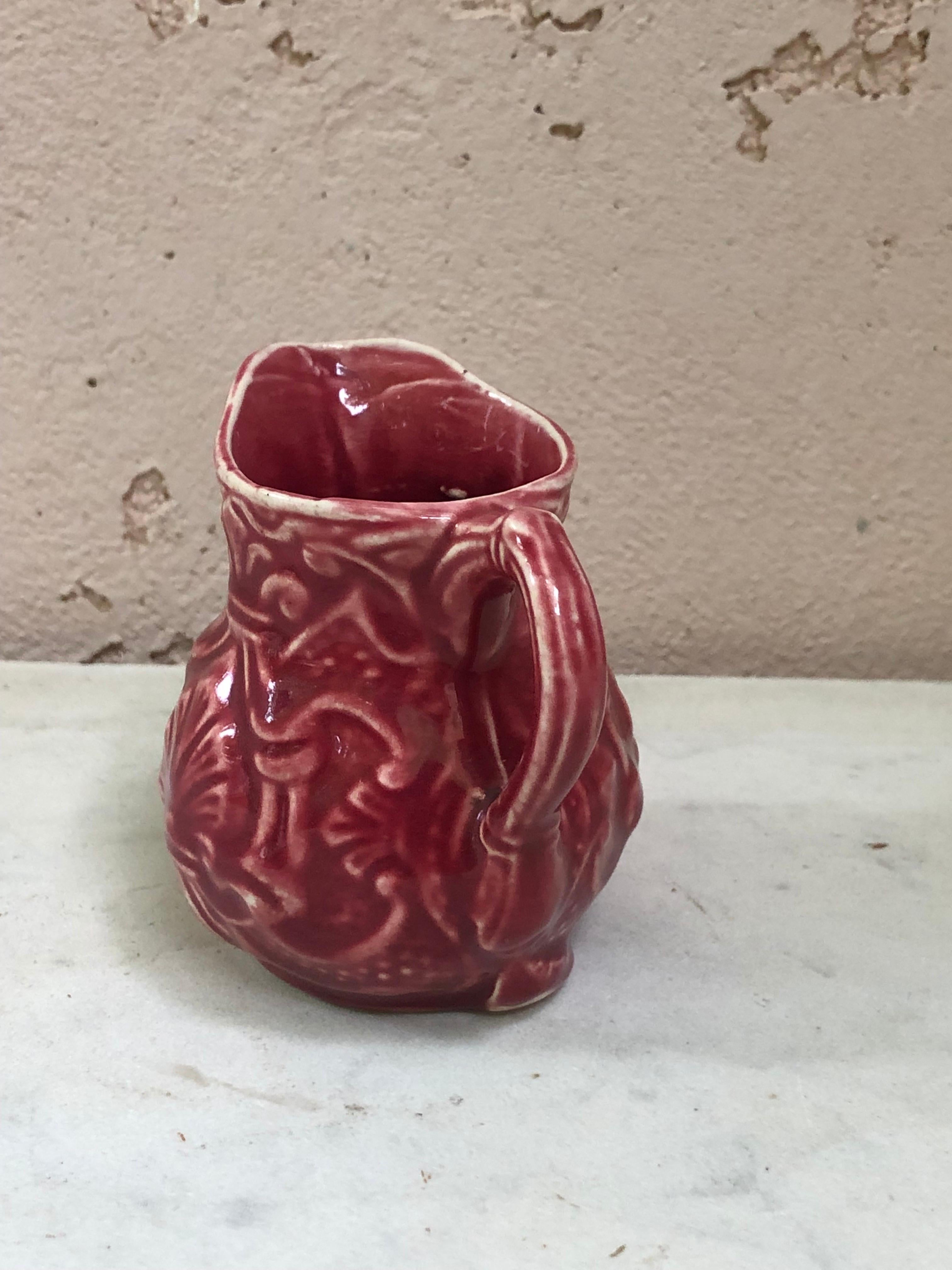 Small French red majolica creamer pitcher signed Onnaing Circa 1920.