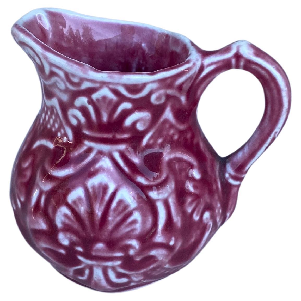 Small French red majolica creamer pitcher signed Onnaing Circa 1920.