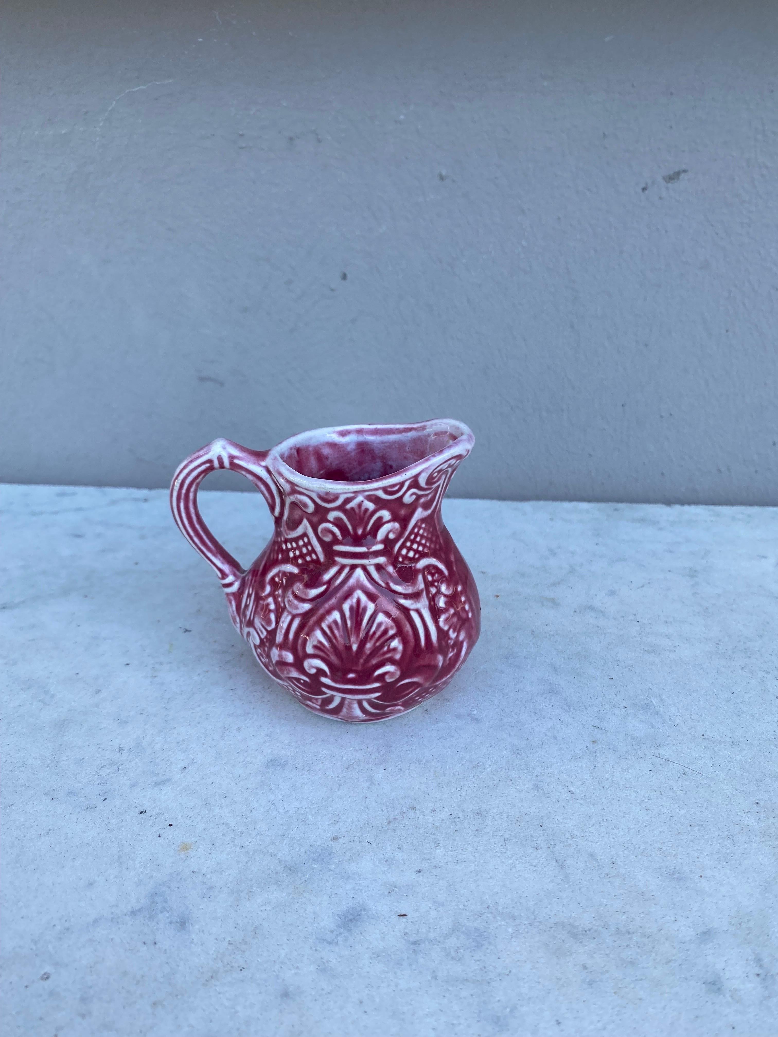 Small French red majolica creamer pitcher signed Onnaing Circa 1920.
