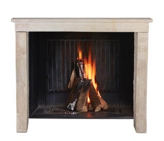Small French Stone Antique Fireplace Surround For Cozy Timeless Living