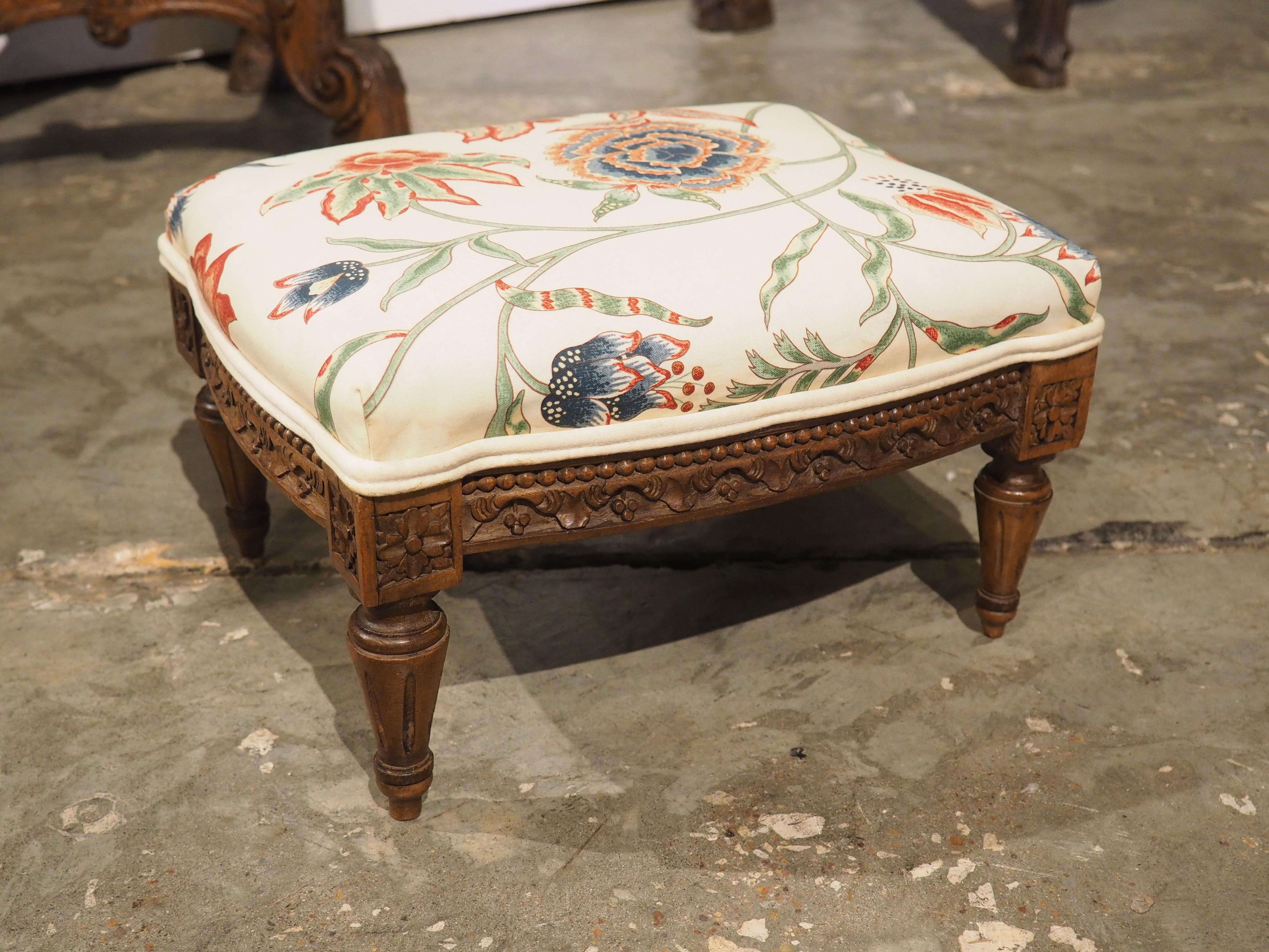More information coming soon…

A small, yet beautiful pied de tabouret, this French foot stool, which dates to circa 1900 is upholstered with Pierre Frey floral print.  The frame, which is hand-carved walnut, is in the style of Louis XVI.