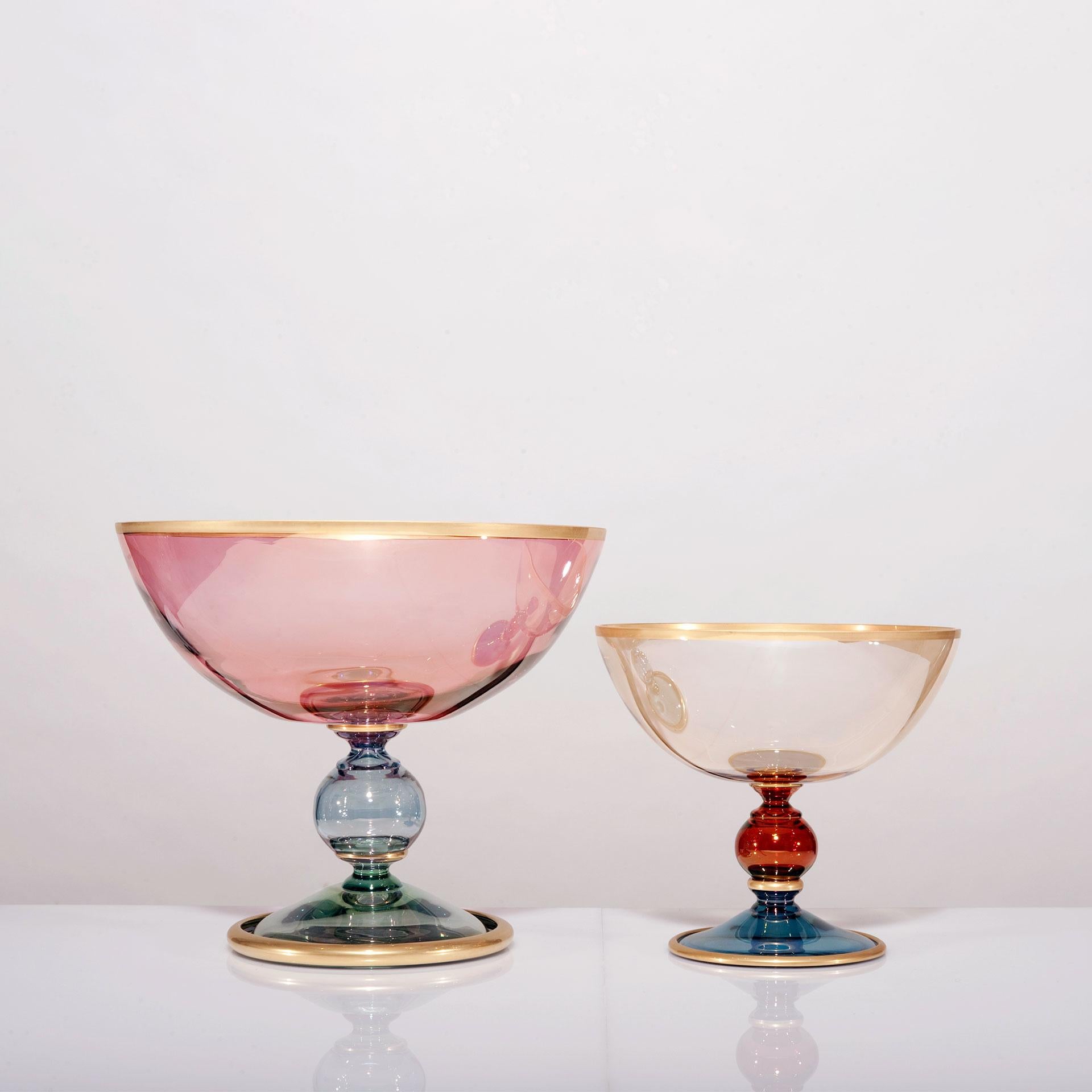 This cup is part of the Dolce Vita collection, made up of finely-crafted glass pieces that are painted by hand in delicate pastel colors and then given a matte satin finish with pure gold accents to make them precious objects of functional decor. 