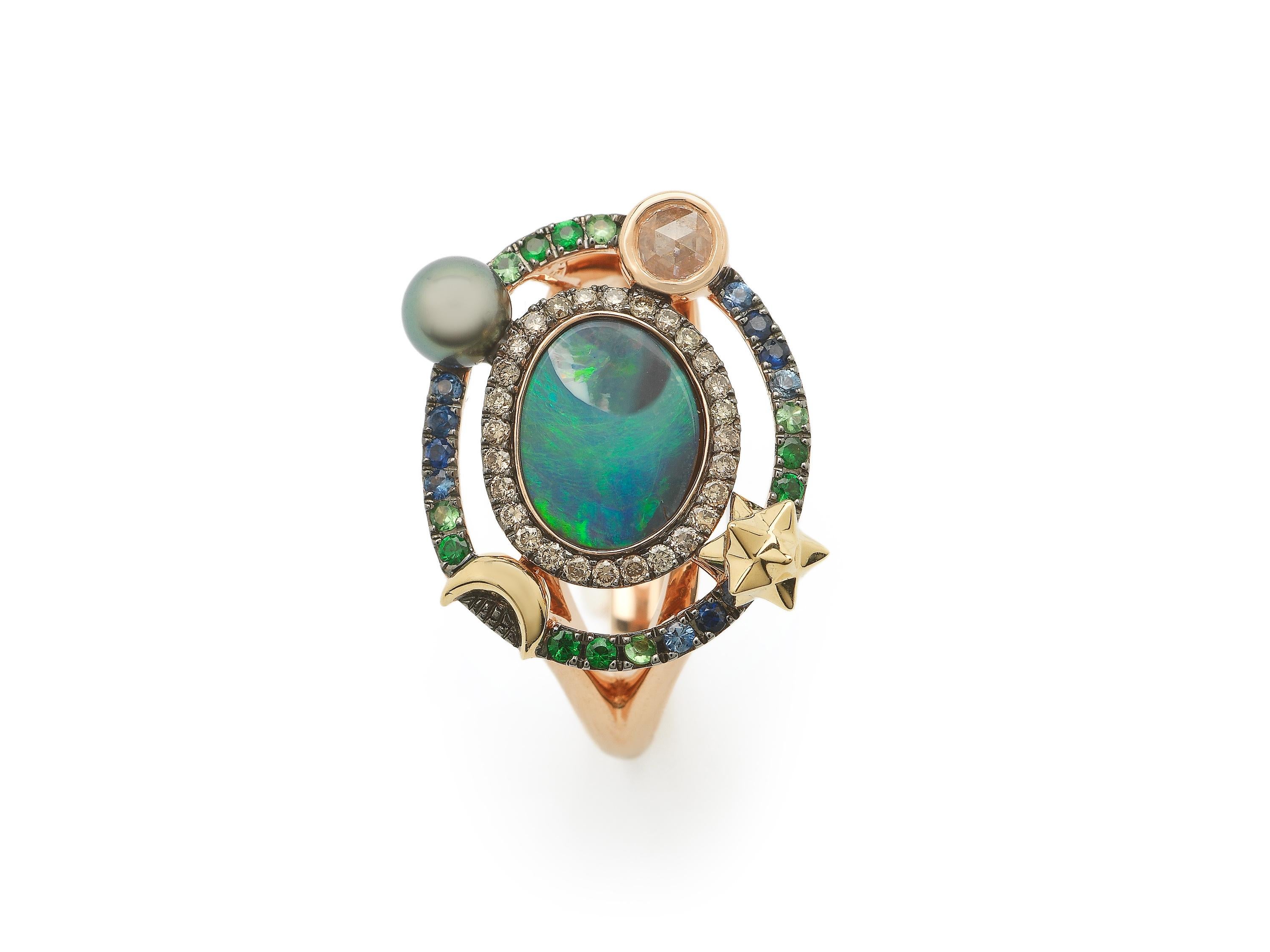 The daintier, but no less striking sibling to the Galaxy Cocktail Ring, this ring is designed in 18k rose and yellow gold, with beautiful opal at its center. With depths that evoke the expanse of the universe, each opal is unique. The stone is