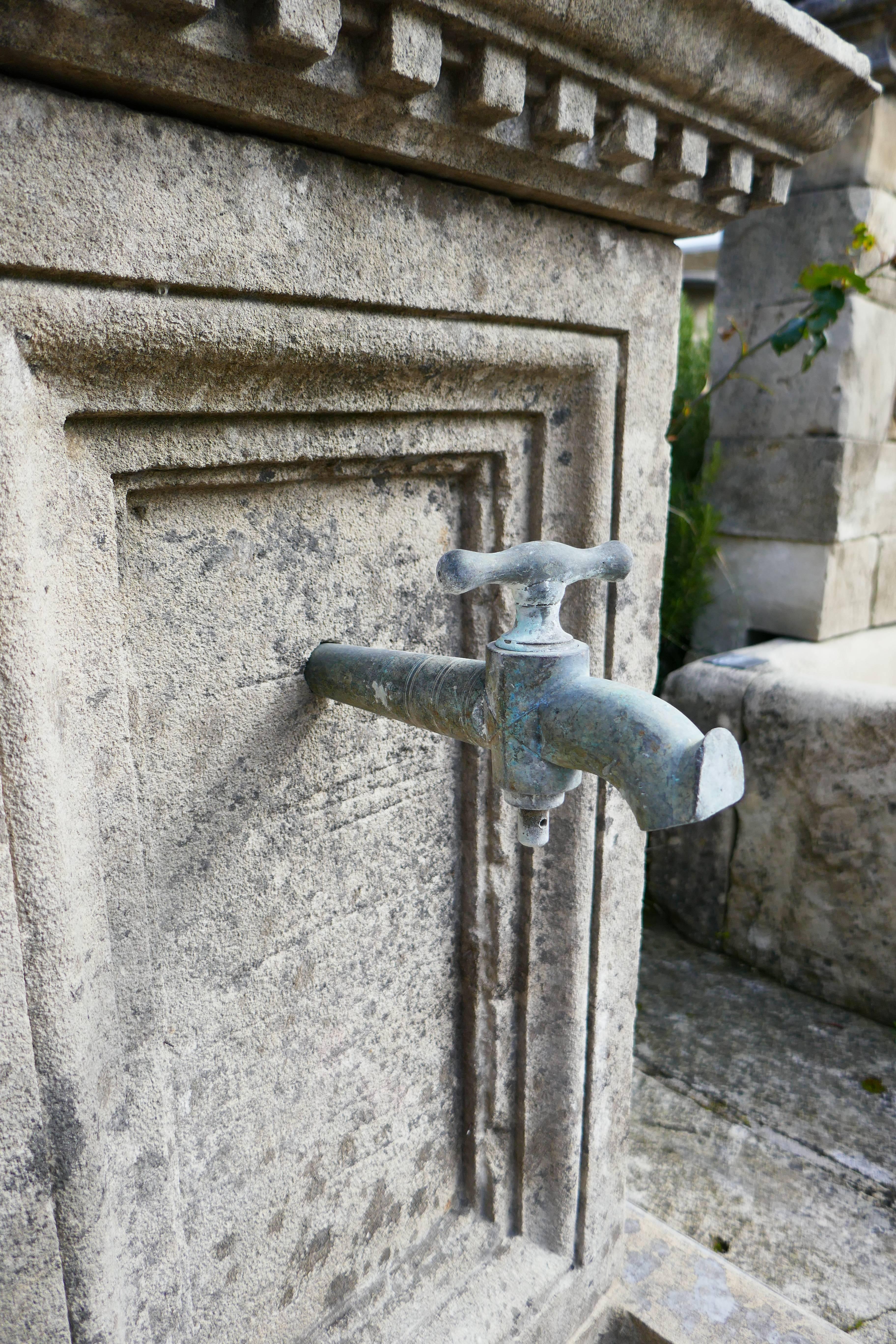 19th Century Small Garden Wall Fountain with Hand-Sculpted Pediment in Aged Stone, Provence For Sale