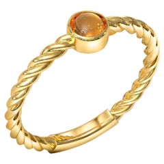 Small garnet cabochon 14k gold ring.